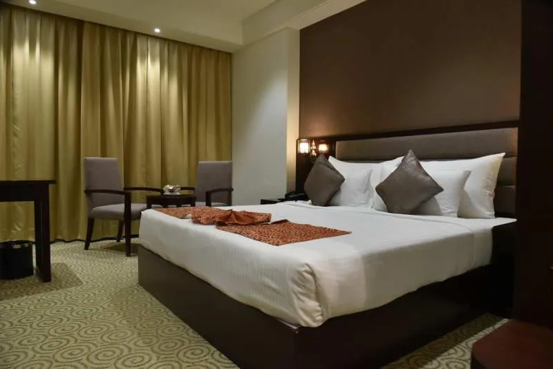 Staff, Bed in Pride Hotel & Convention Centre Indore