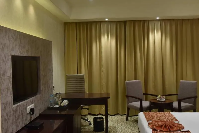 People, Bed in Pride Hotel & Convention Centre Indore