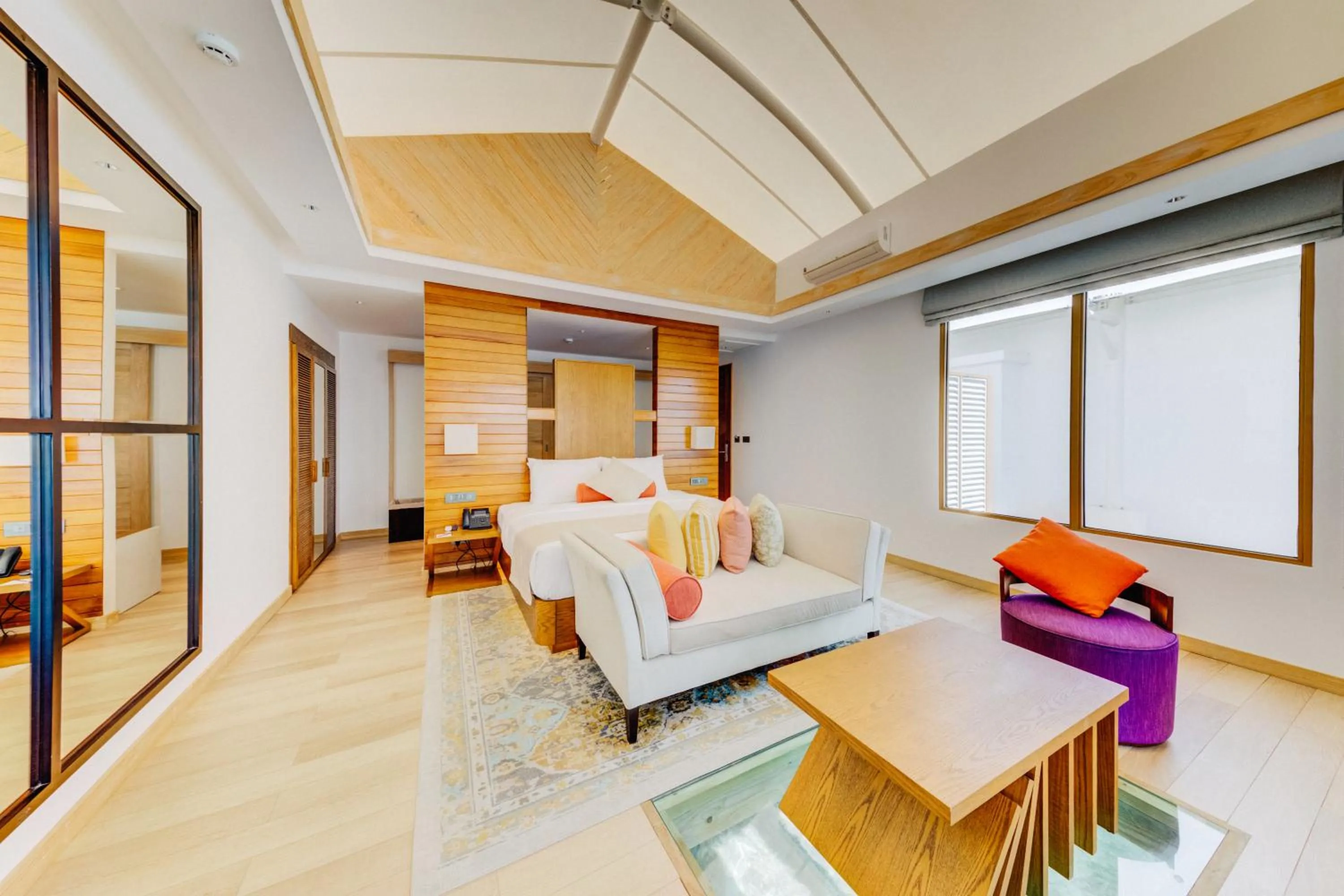 Living room, Bed in Cinnamon Hakuraa Huraa Maldives - All Inclusive Adults-Only Escape with One-way Free Speedboat