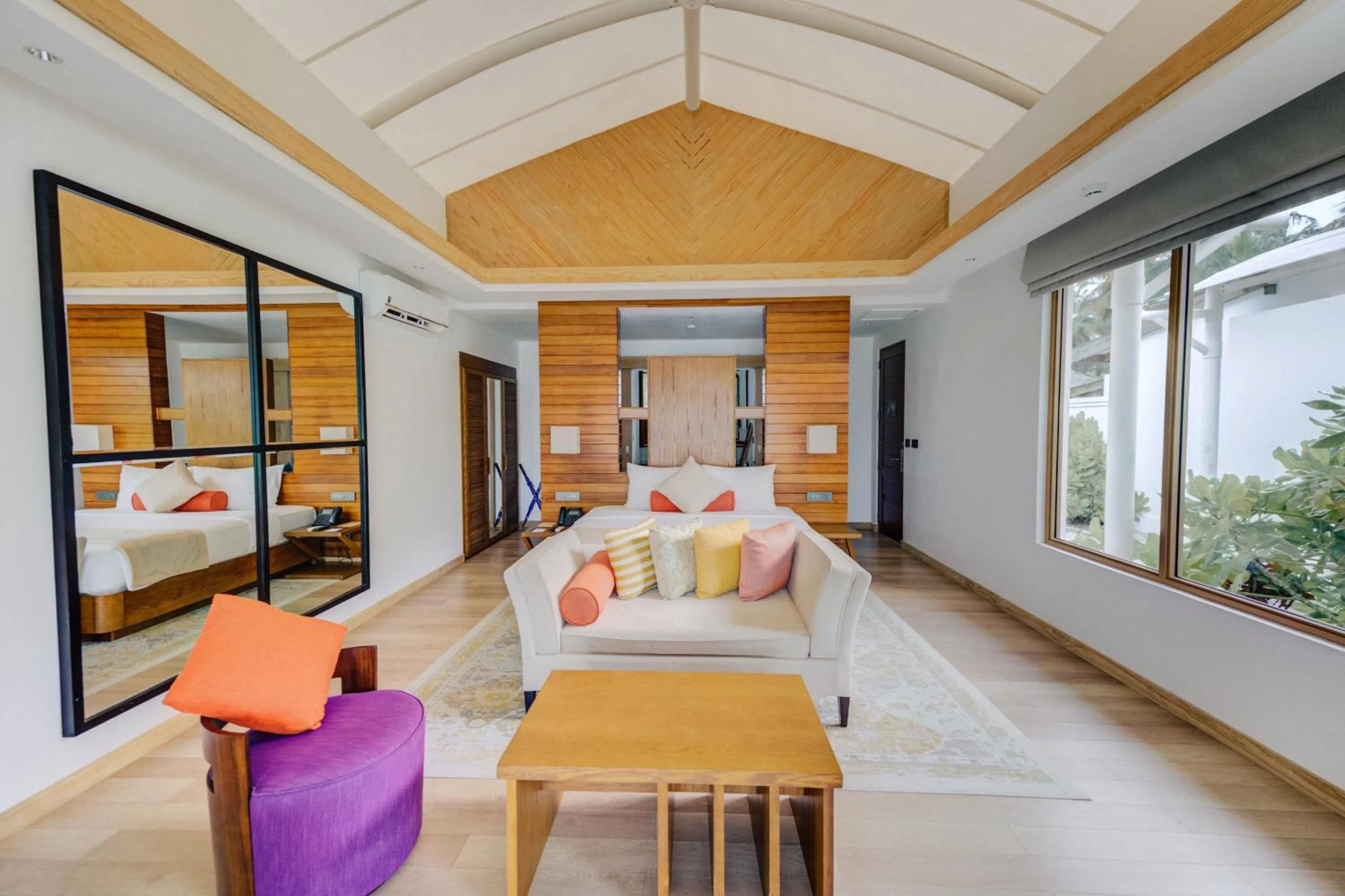 Living room, Bed in Cinnamon Hakuraa Huraa Maldives - All Inclusive Adults-Only Escape with One-way Free Speedboat
