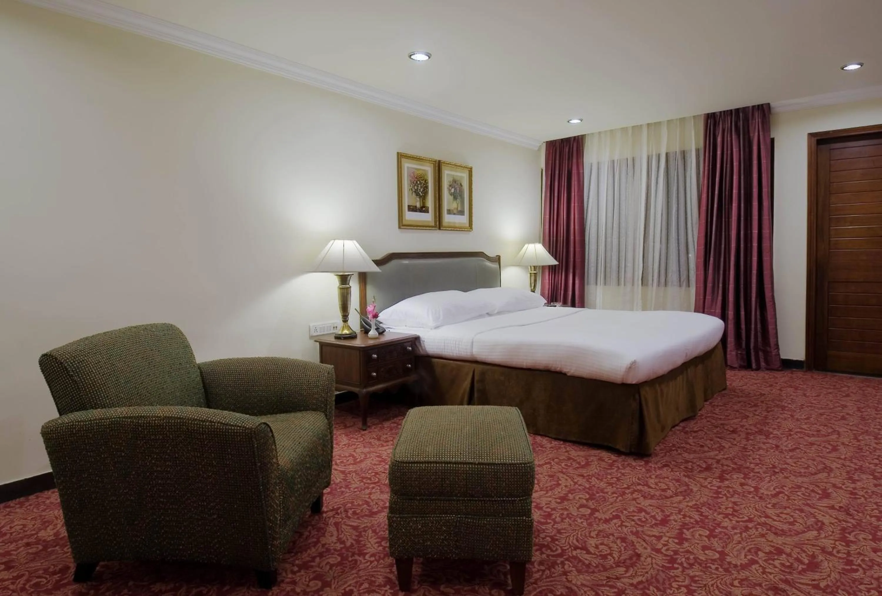 Photo of the whole room, Bed in Mayfair Rourkela