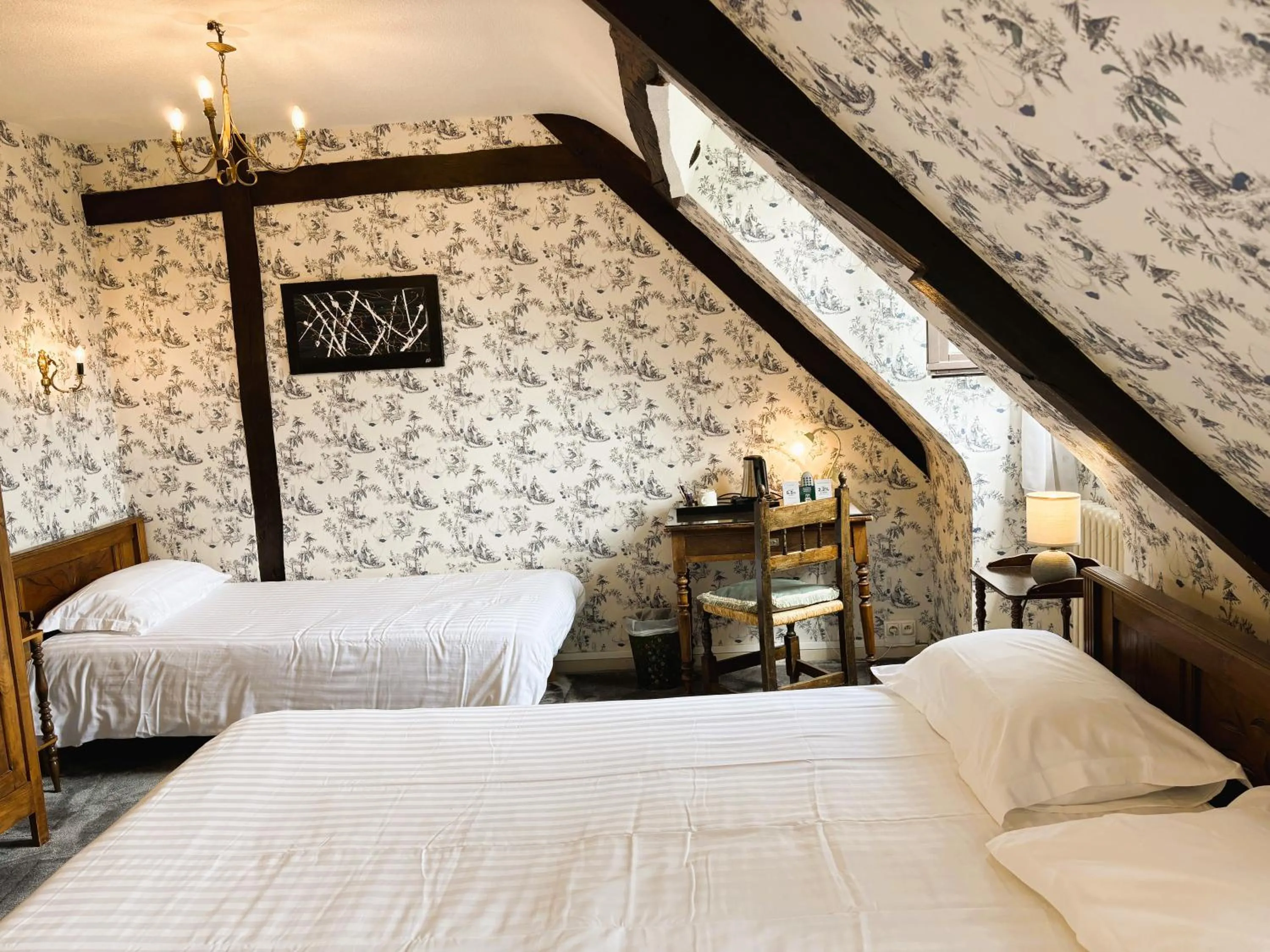 Bed in Logis Hôtel Beau Site