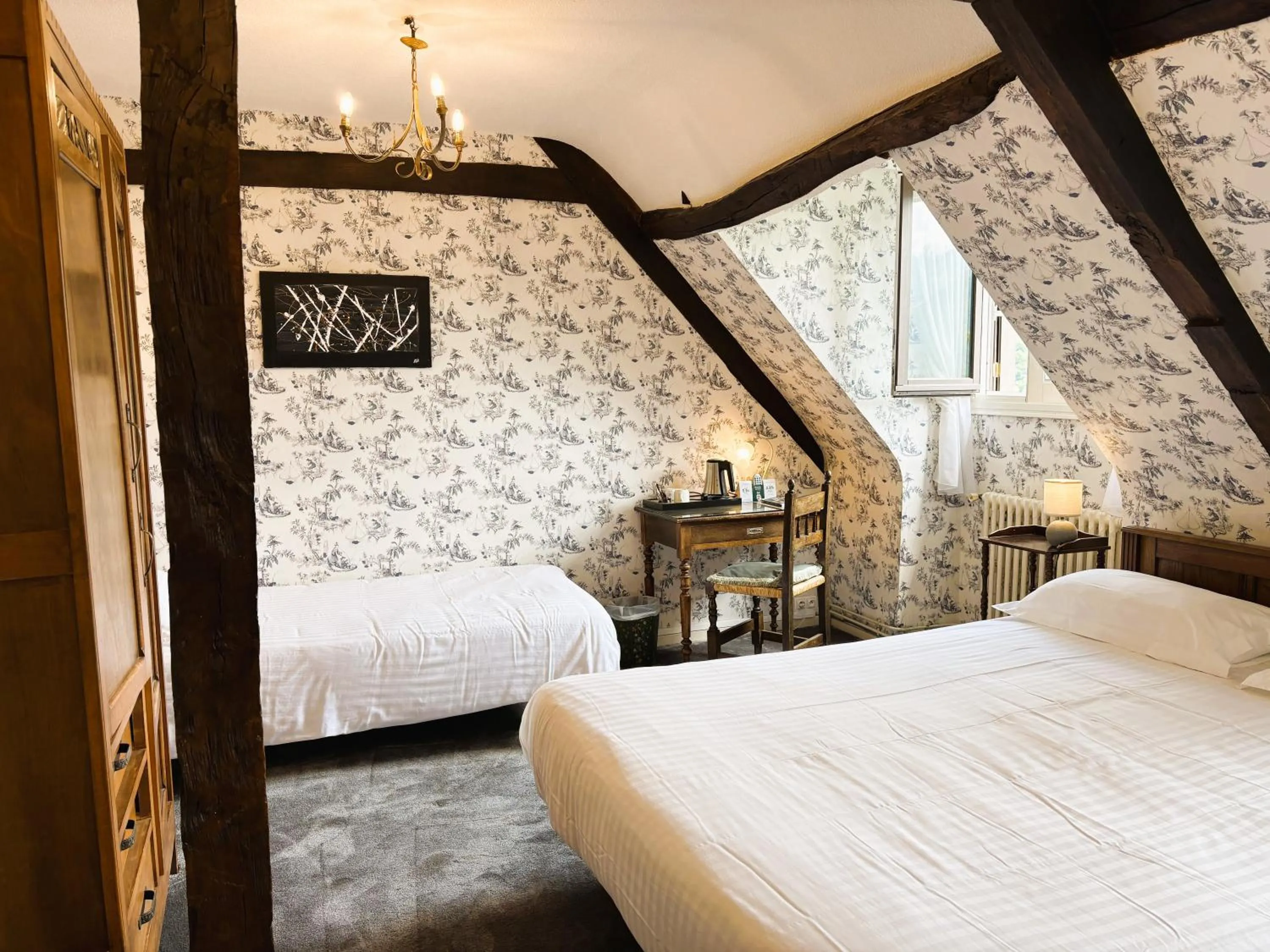 Bed in Logis Hôtel Beau Site
