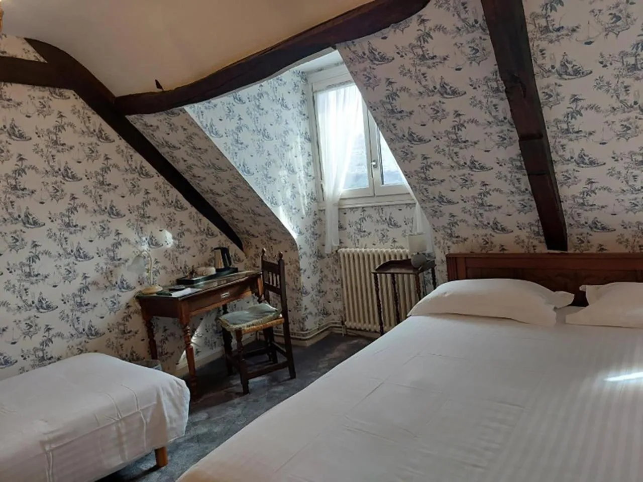 Bed in Logis Hôtel Beau Site