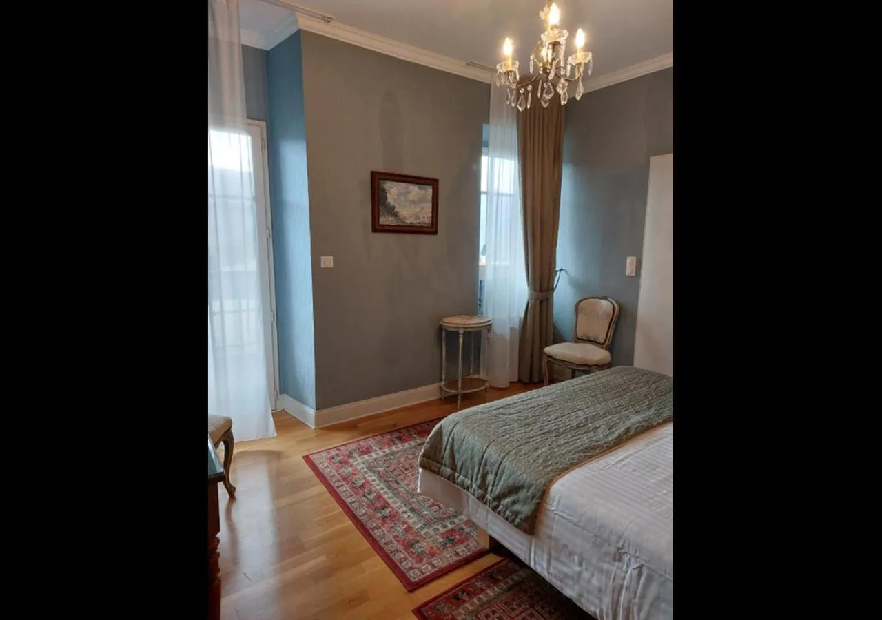 Bed in Logis Hôtel Beau Site