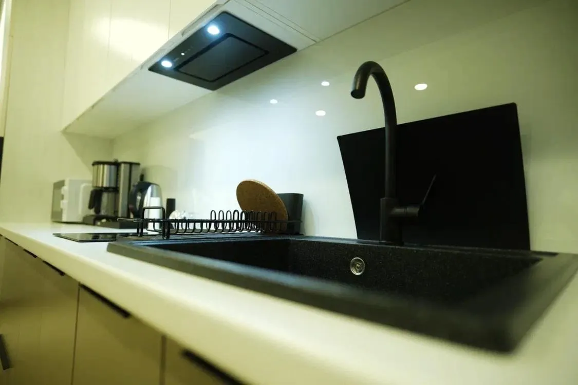 Kitchen or kitchenette in 4Guest Hotel