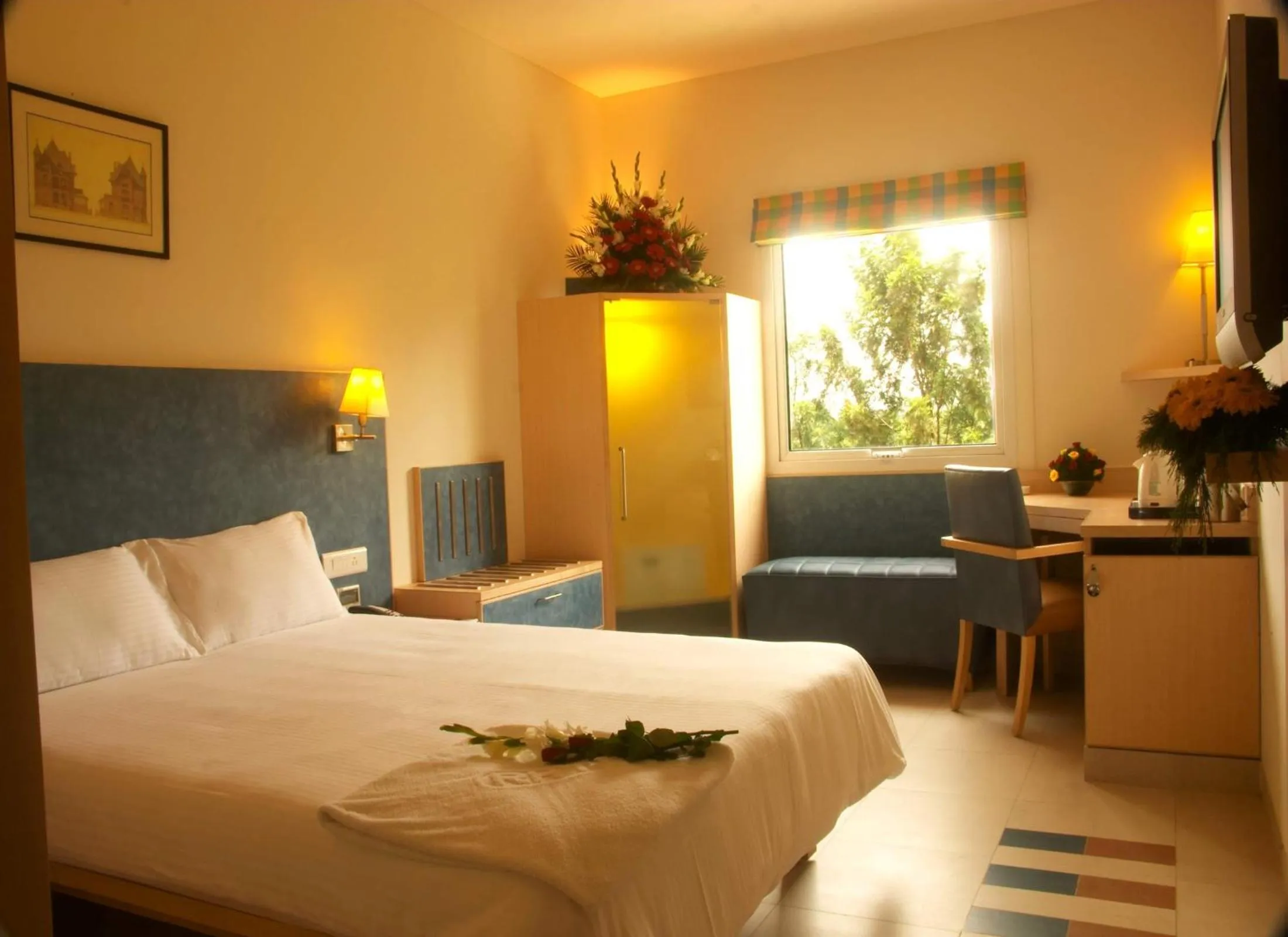 Photo of the whole room, Bed in Radha Hometel