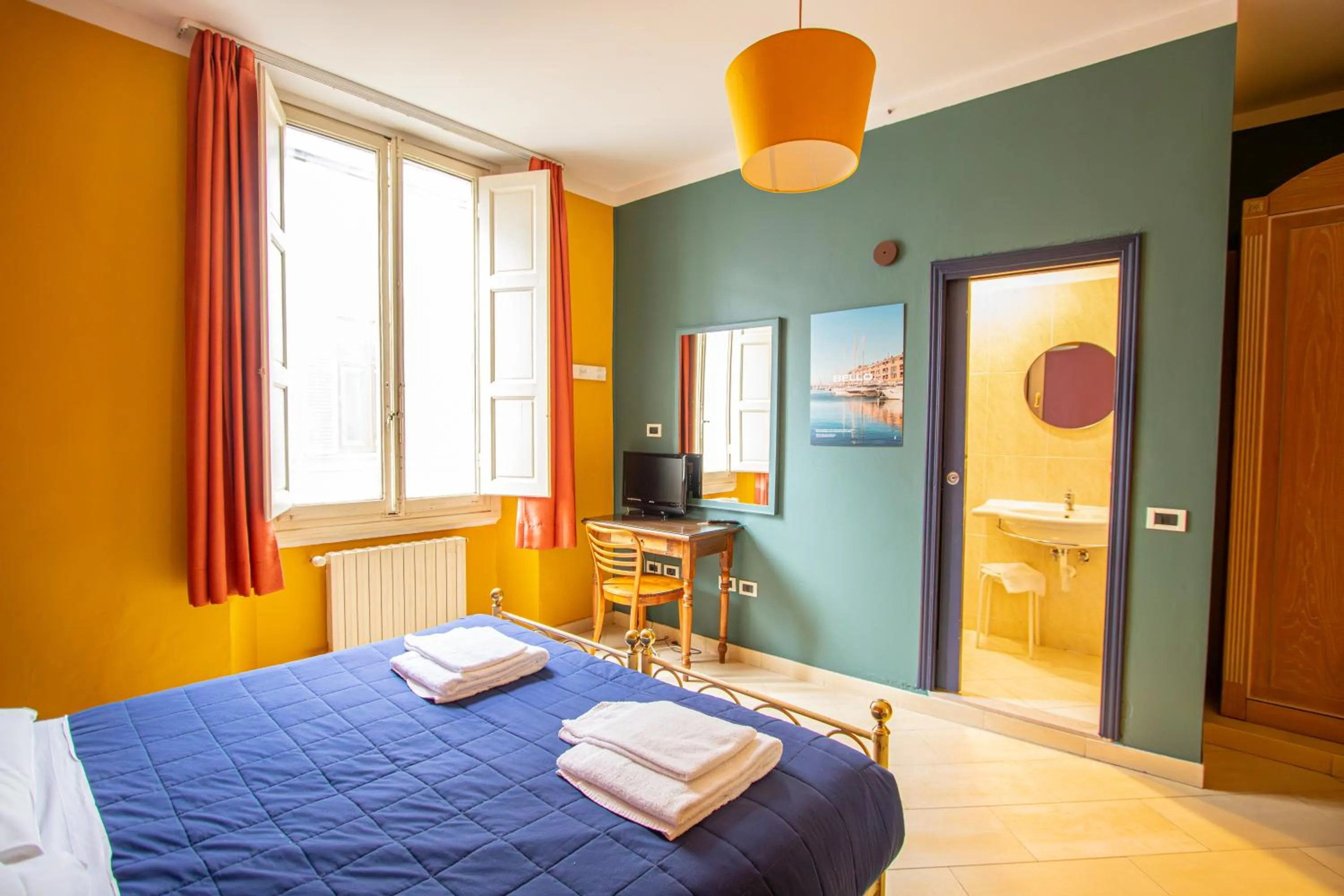 Bed in Hotel Merlini