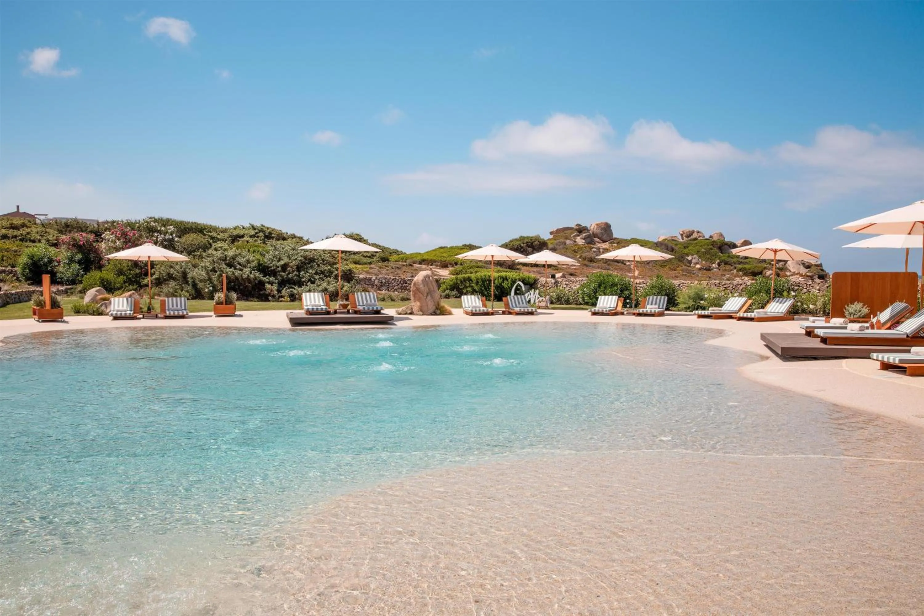 Pool view in Mangia's Santa Teresa Sardinia, Curio Collection by Hilton