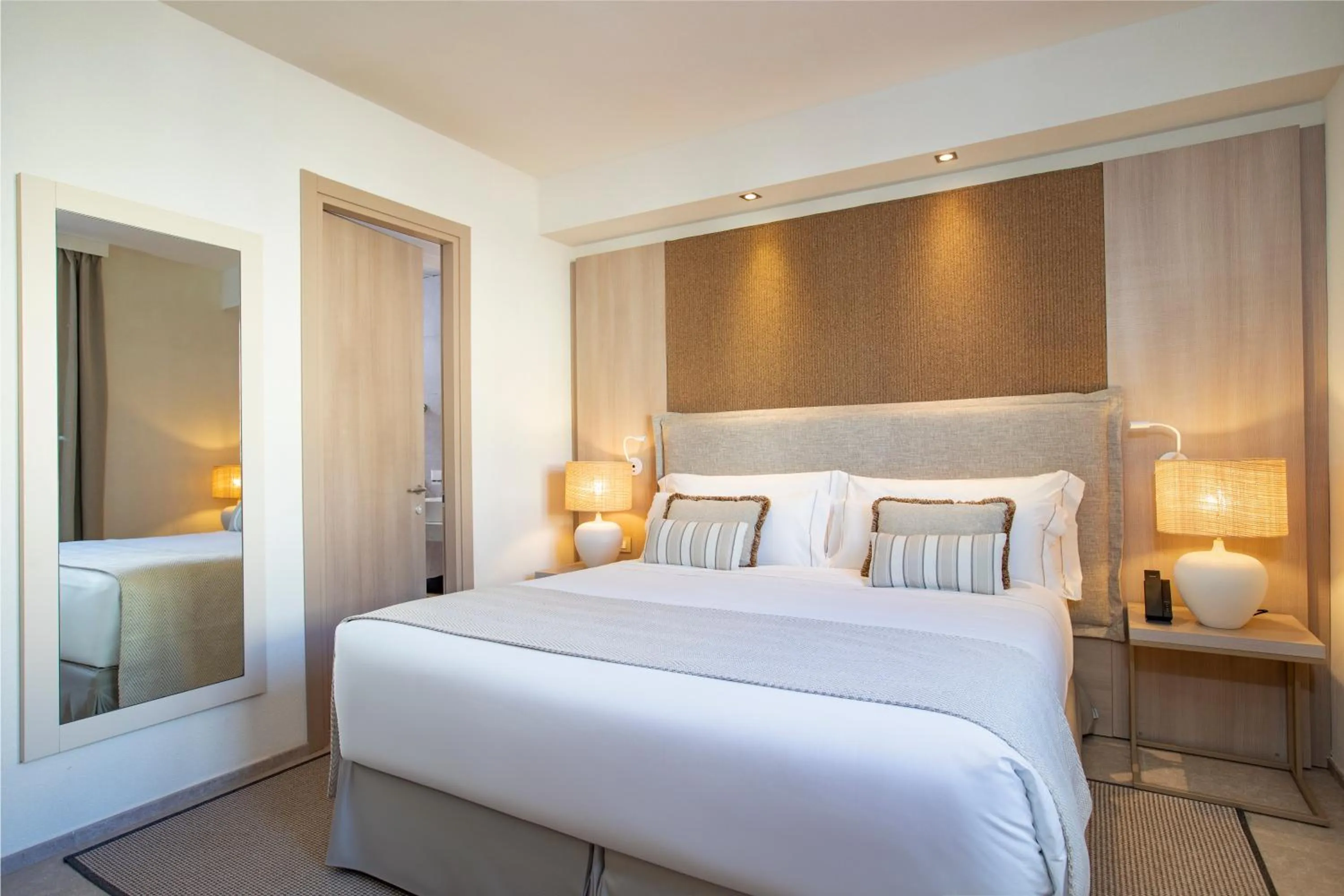 Bed in Mangia's Santa Teresa Sardinia, Curio Collection by Hilton