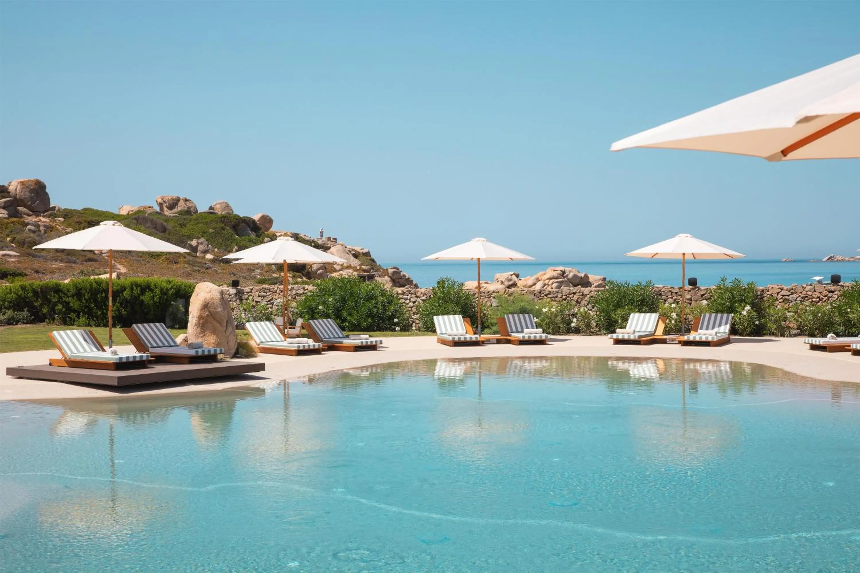 Pool view in Mangia's Santa Teresa Sardinia, Curio Collection by Hilton