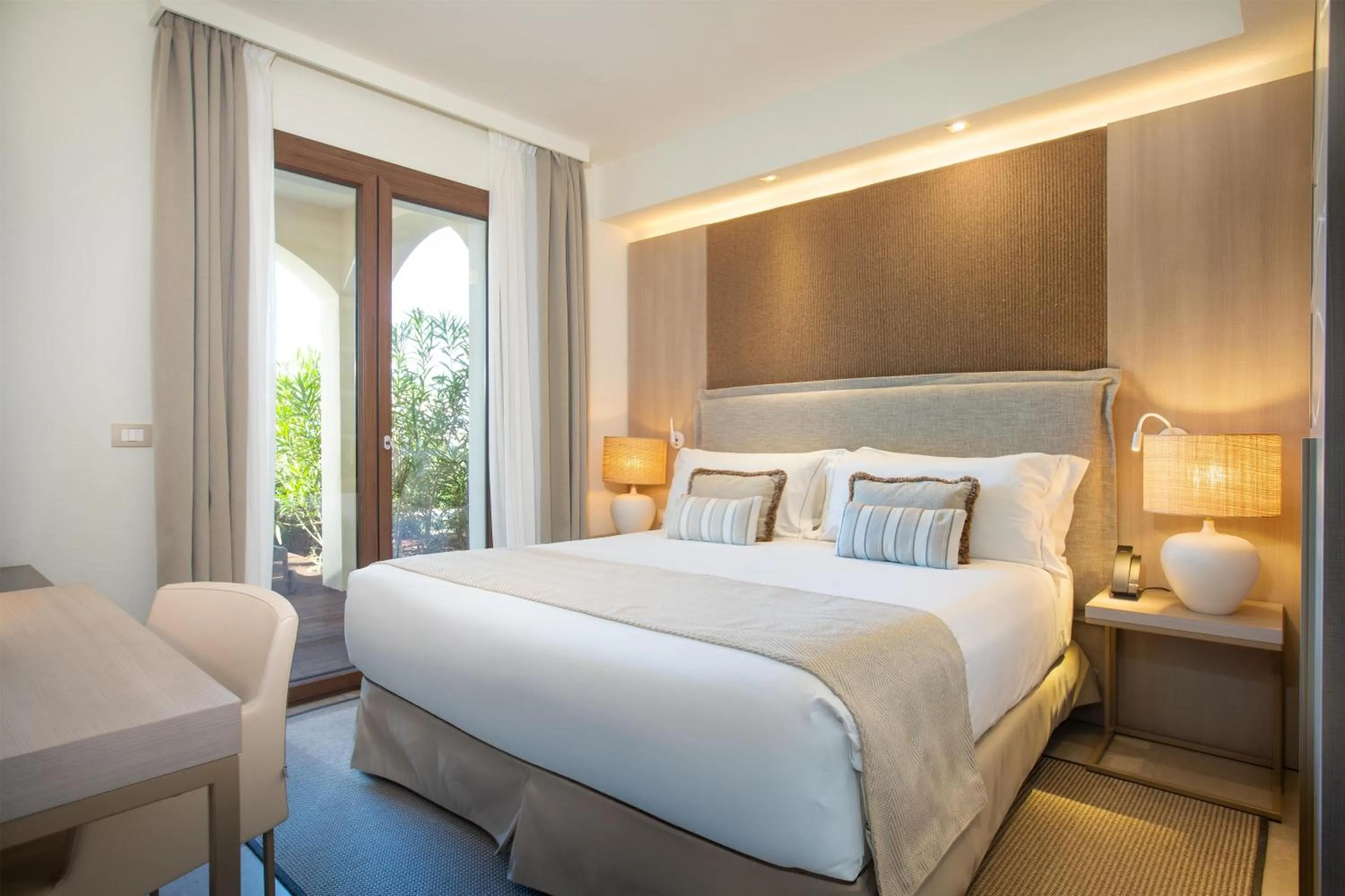 Bed in Mangia's Santa Teresa Sardinia, Curio Collection by Hilton