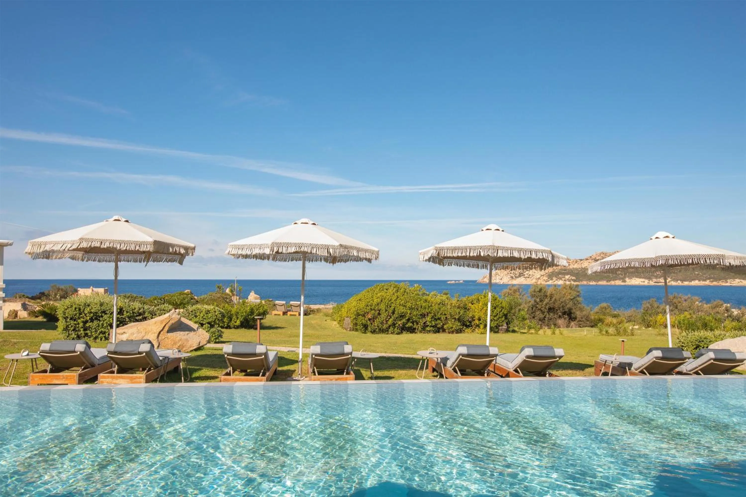 Pool view in Mangia's Santa Teresa Sardinia, Curio Collection by Hilton