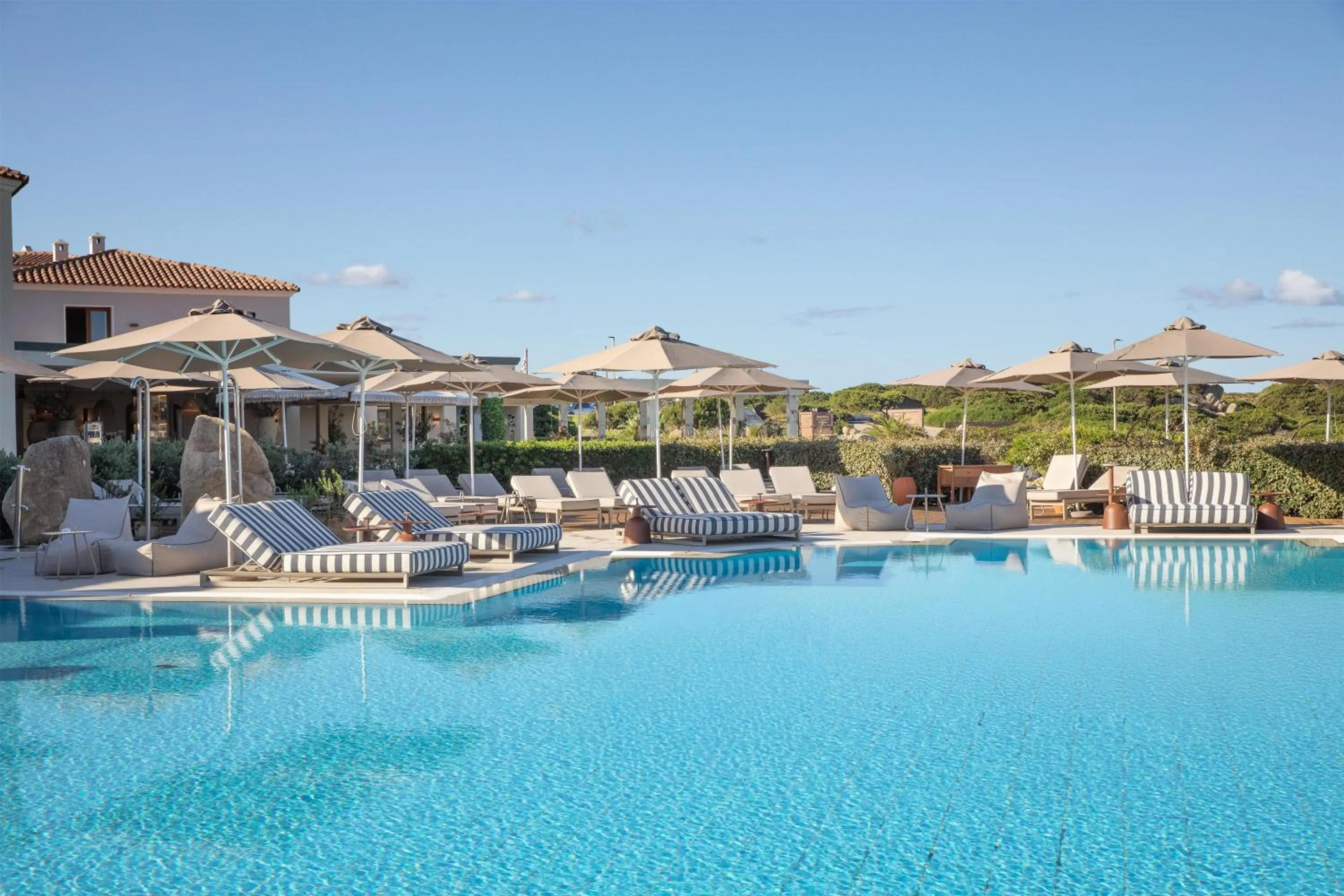Pool view in Mangia's Santa Teresa Sardinia, Curio Collection by Hilton