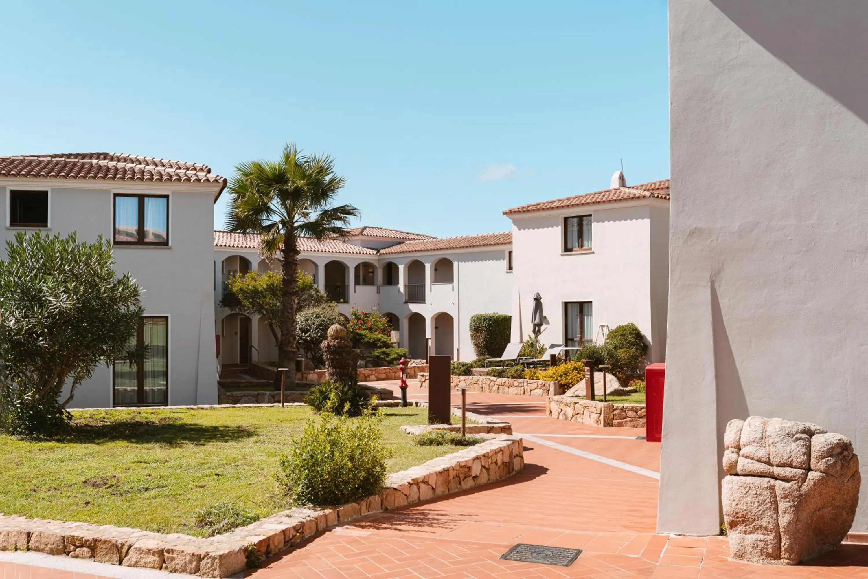 Property logo or sign in Mangia's Santa Teresa Sardinia, Curio Collection by Hilton