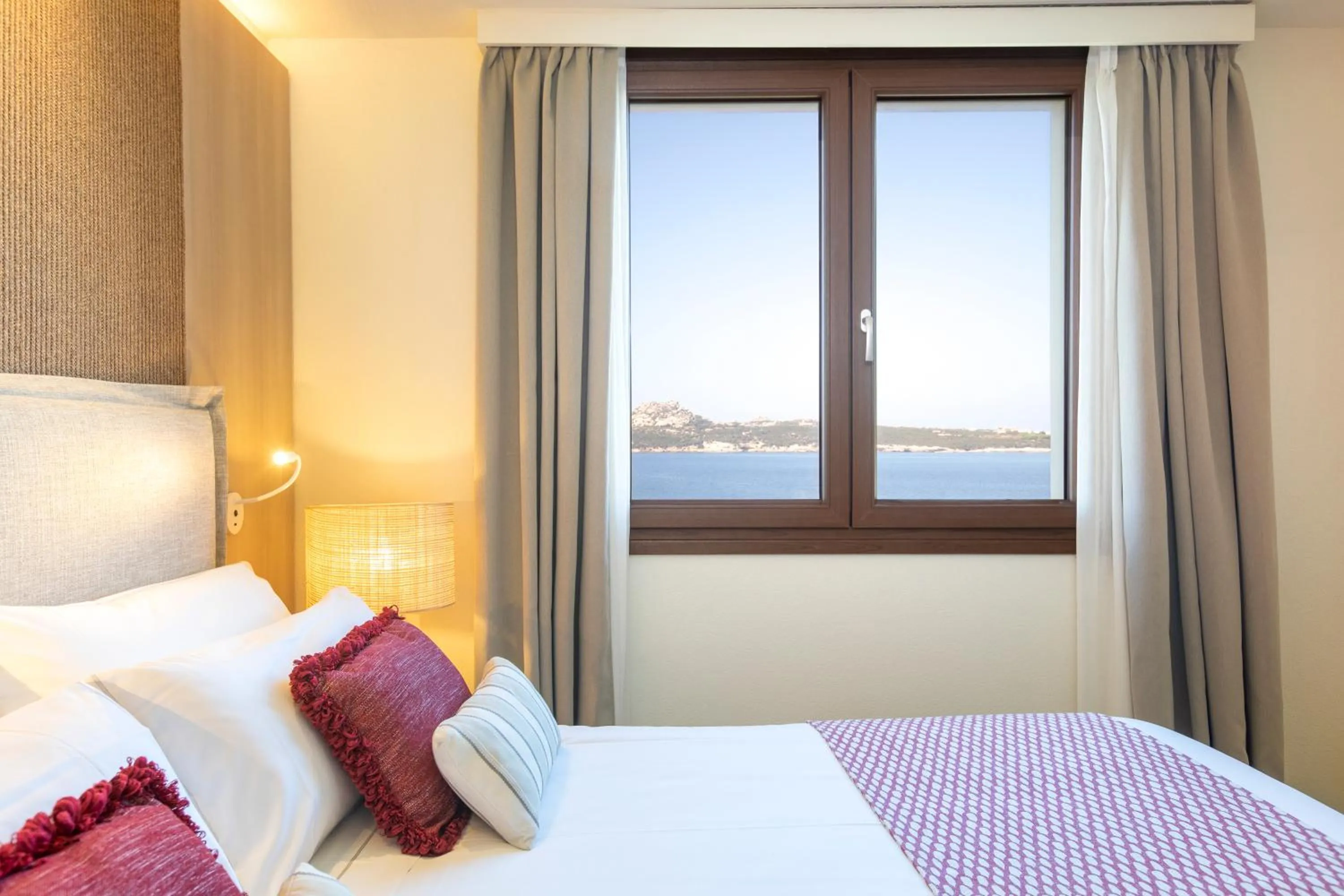 Bed in Mangia's Santa Teresa Sardinia, Curio Collection by Hilton