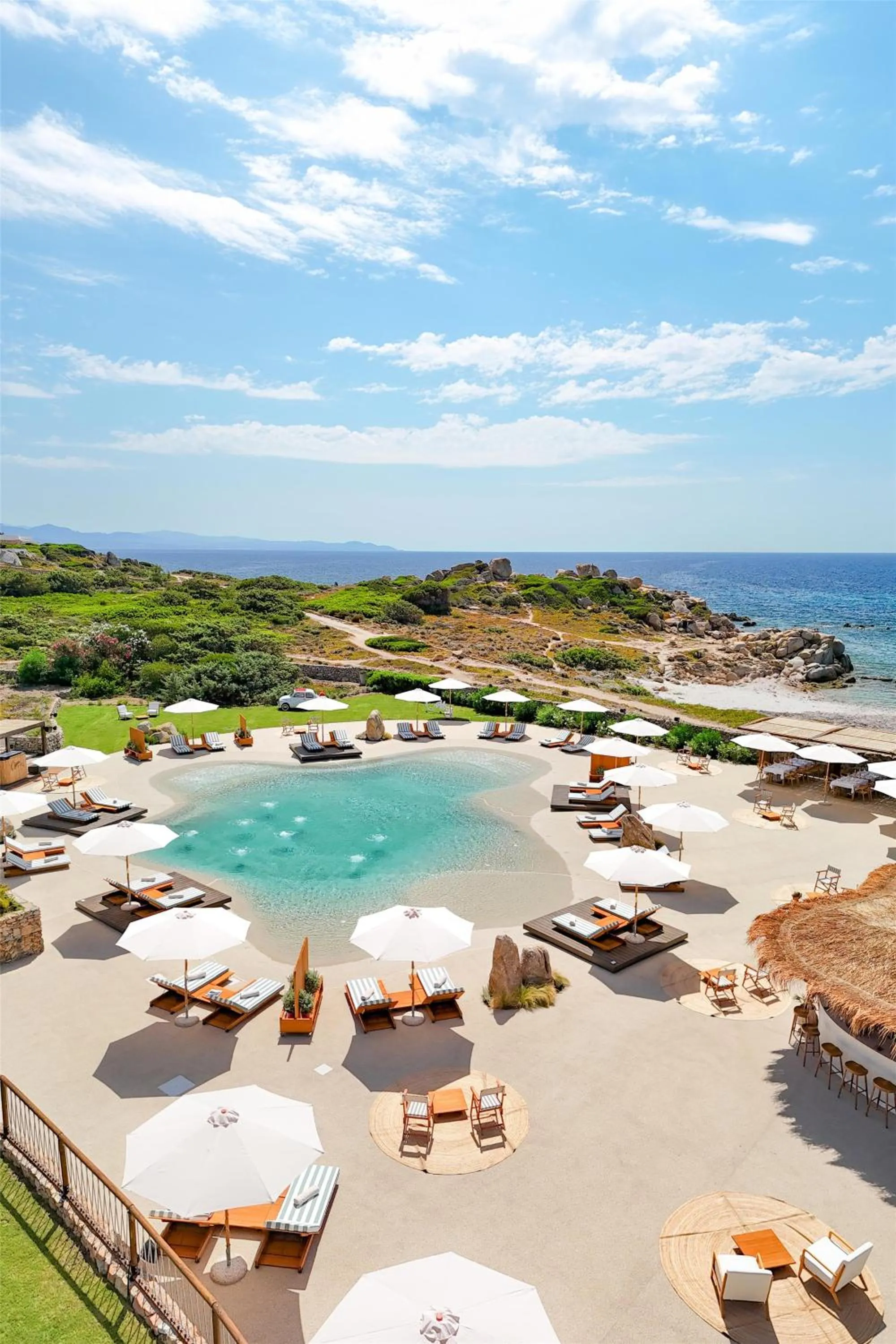 Pool view in Mangia's Santa Teresa Sardinia, Curio Collection by Hilton