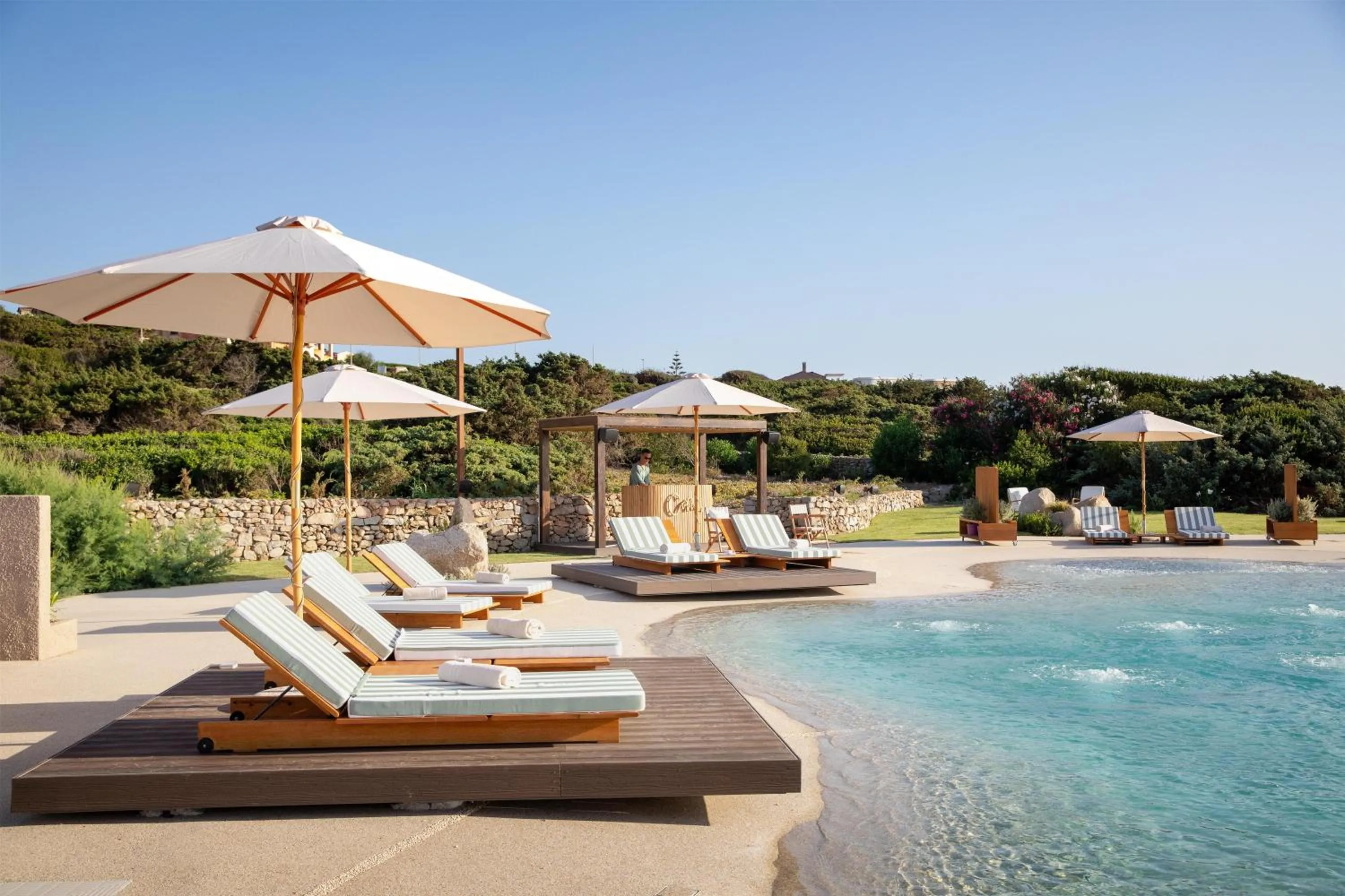 Pool view in Mangia's Santa Teresa Sardinia, Curio Collection by Hilton