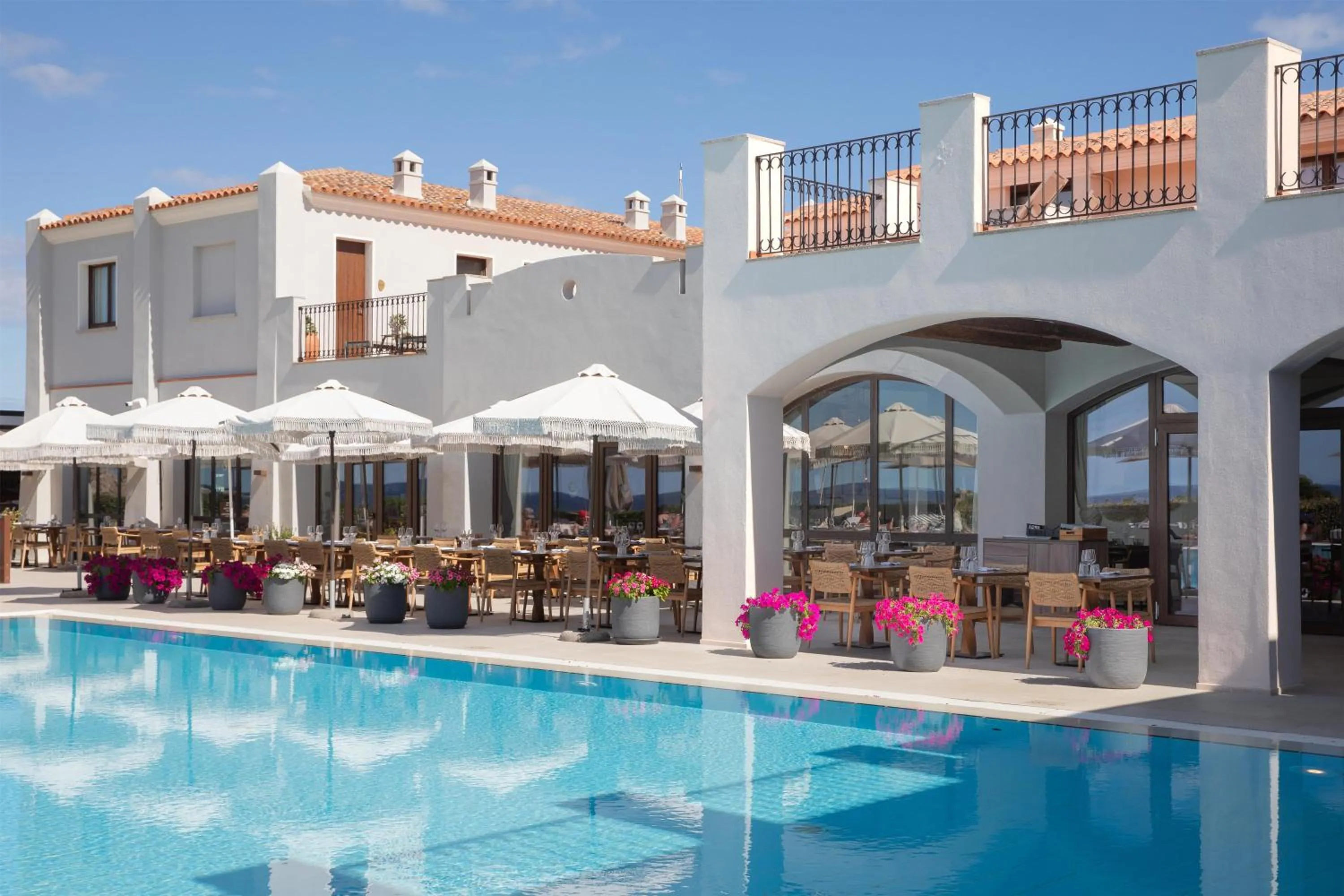 Pool view in Mangia's Santa Teresa Sardinia, Curio Collection by Hilton