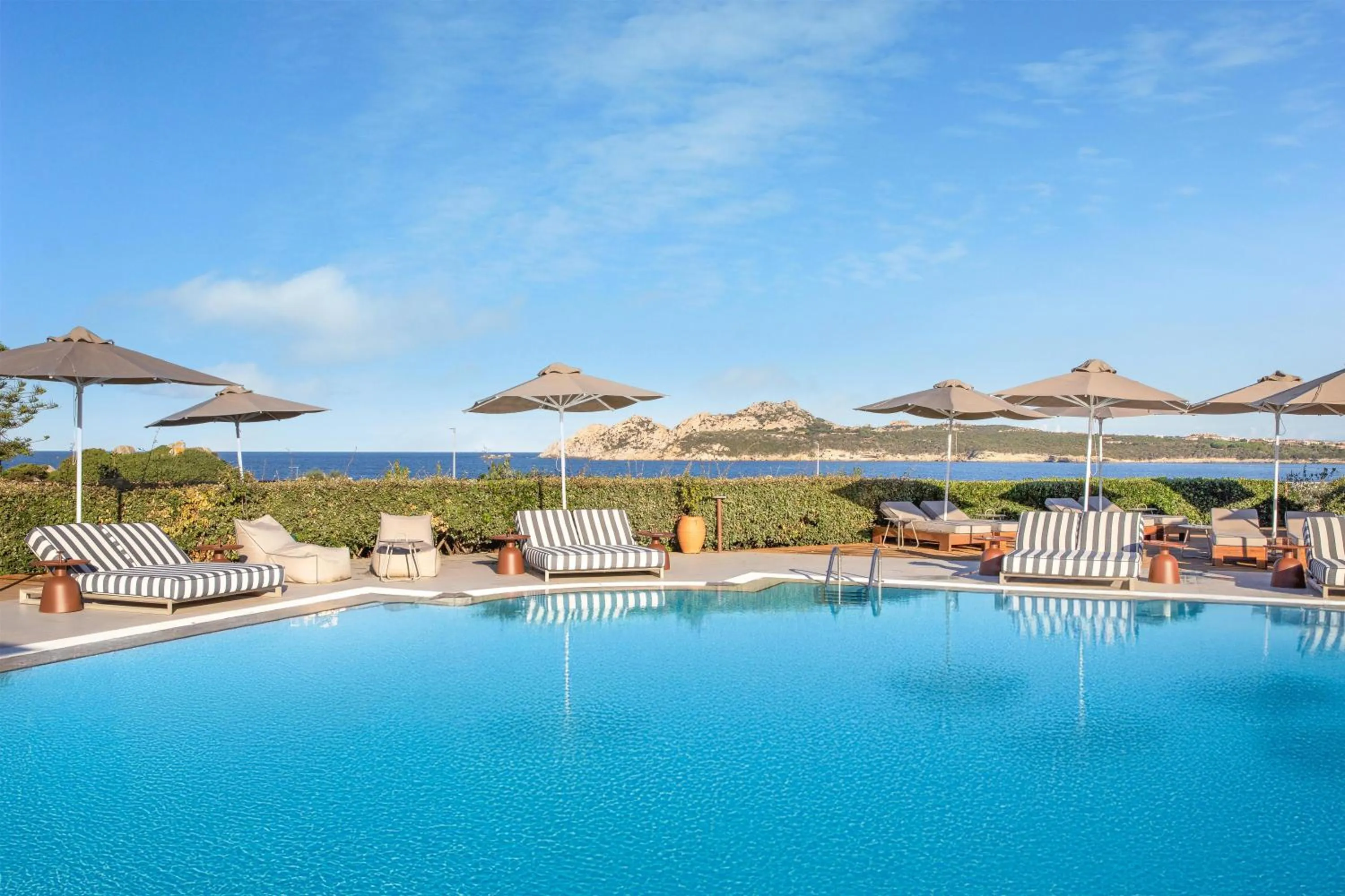 Pool view in Mangia's Santa Teresa Sardinia, Curio Collection by Hilton