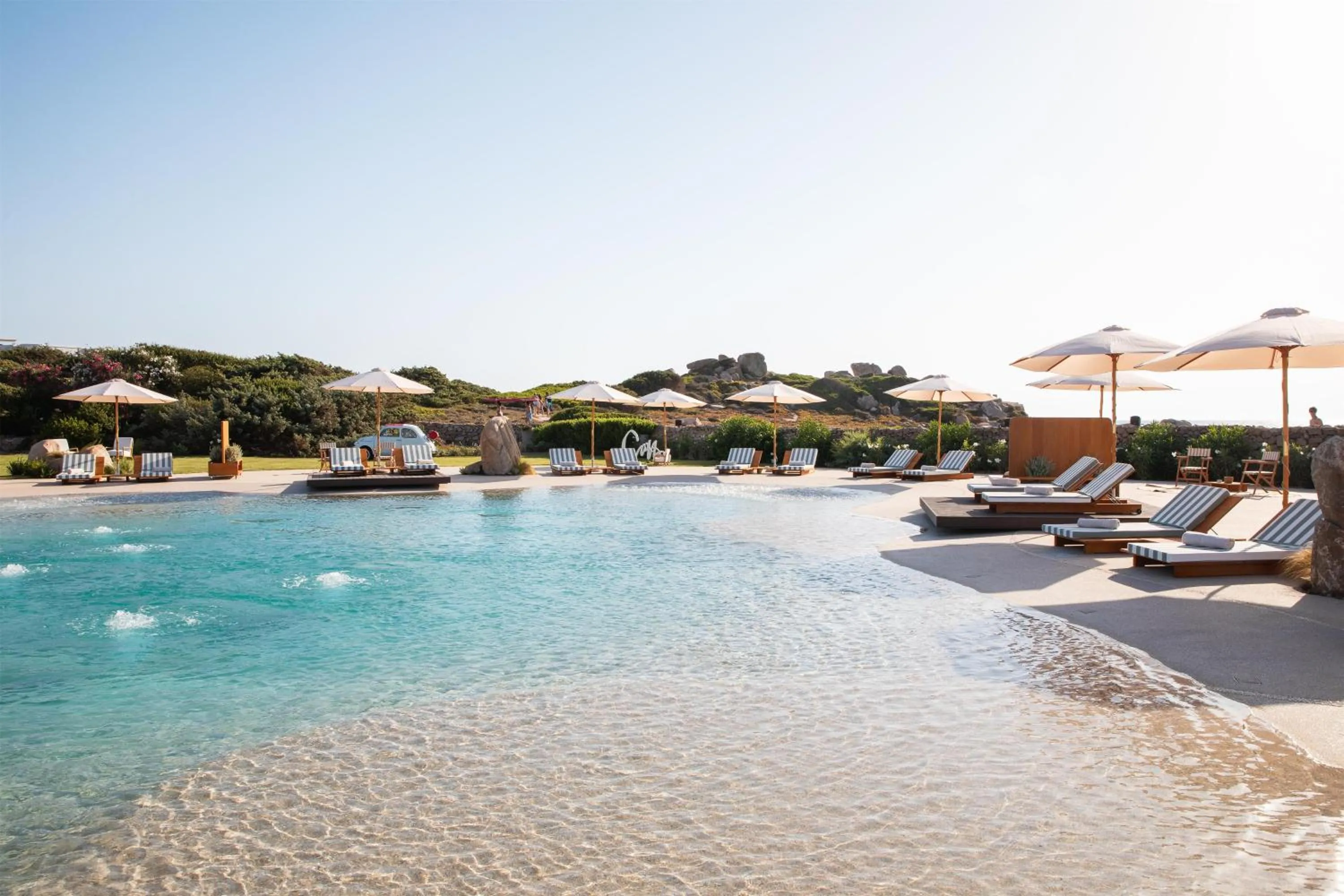 Pool view in Mangia's Santa Teresa Sardinia, Curio Collection by Hilton