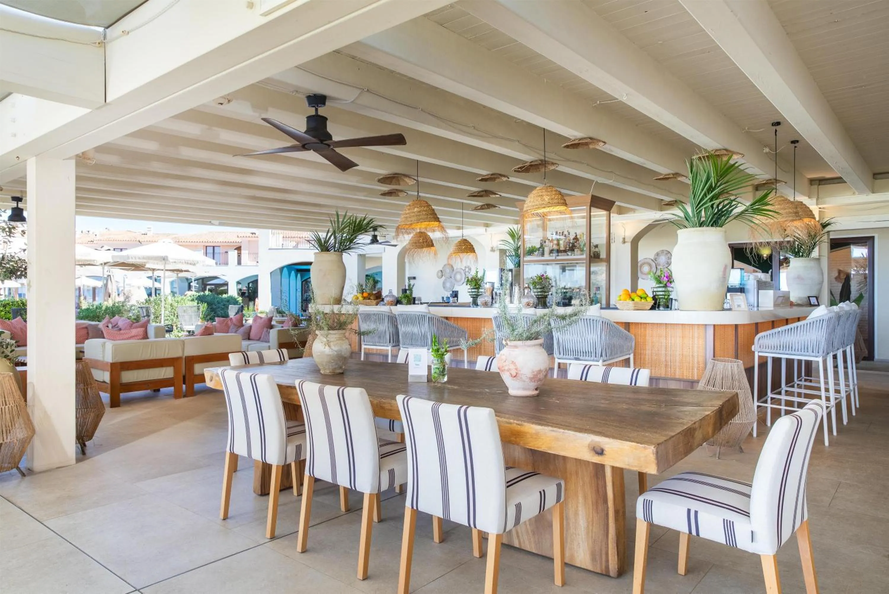 Lounge or bar in Mangia's Santa Teresa Sardinia, Curio Collection by Hilton