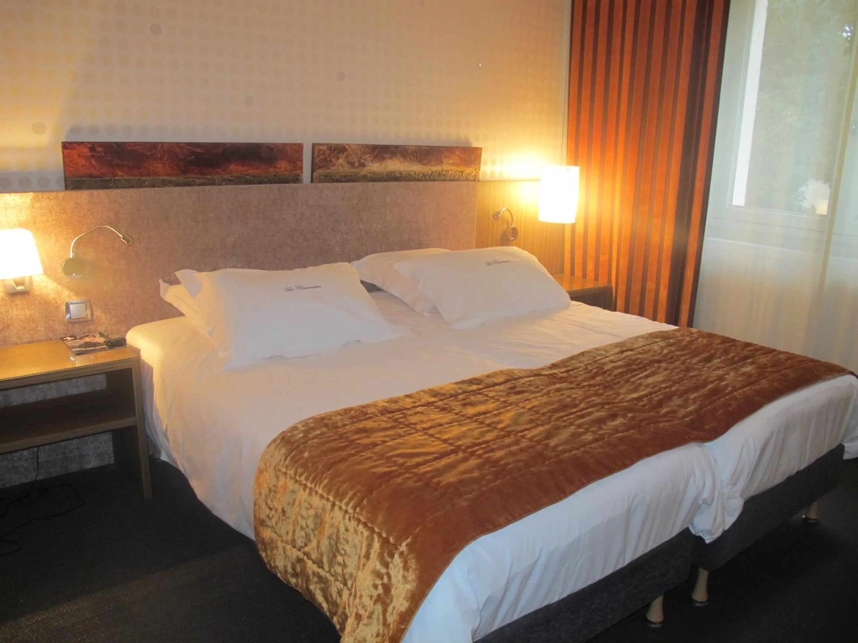 Bed in Hotel La Chaumiere