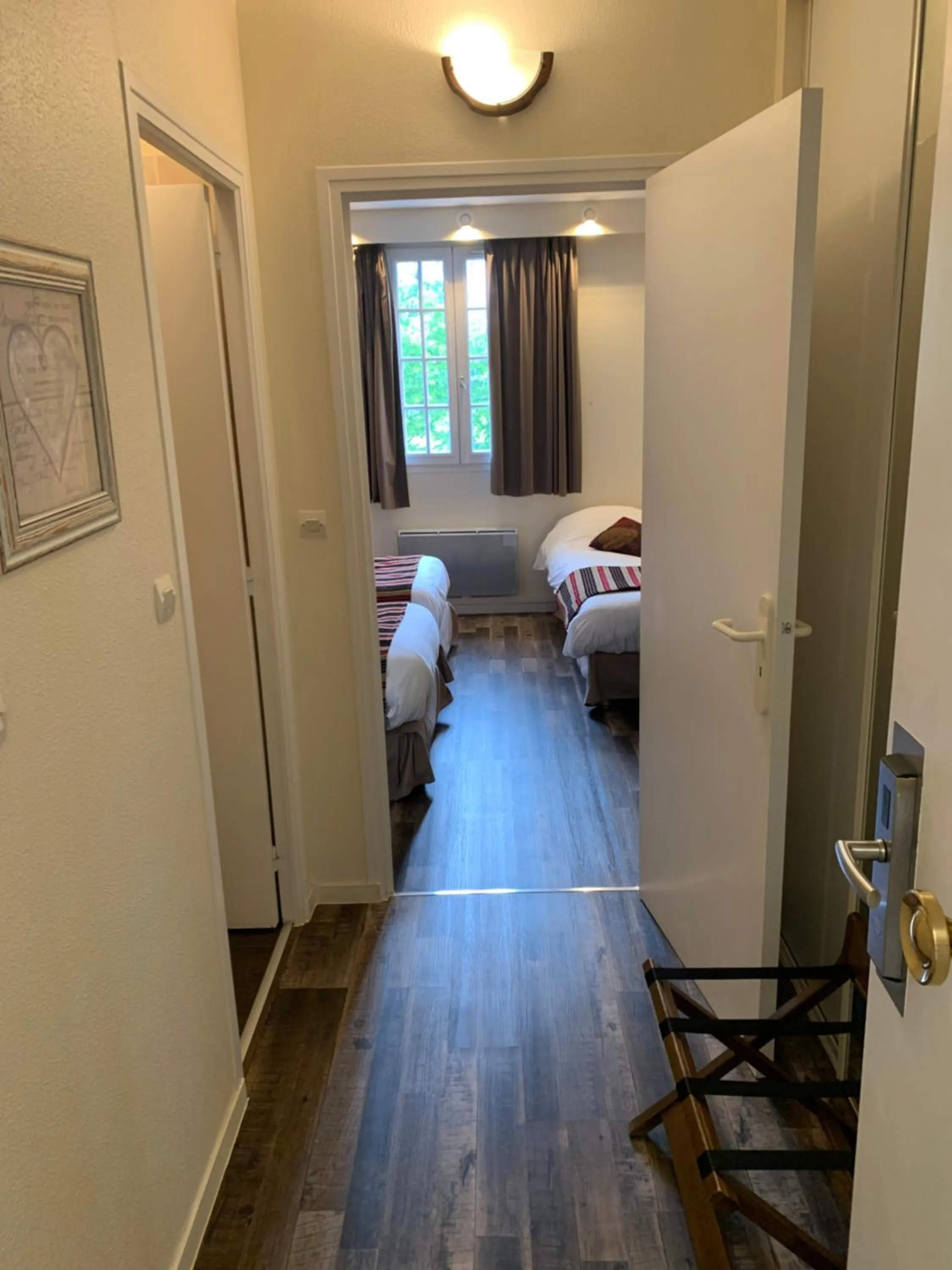 Bed in Logis Hôtel Les Nymphéas