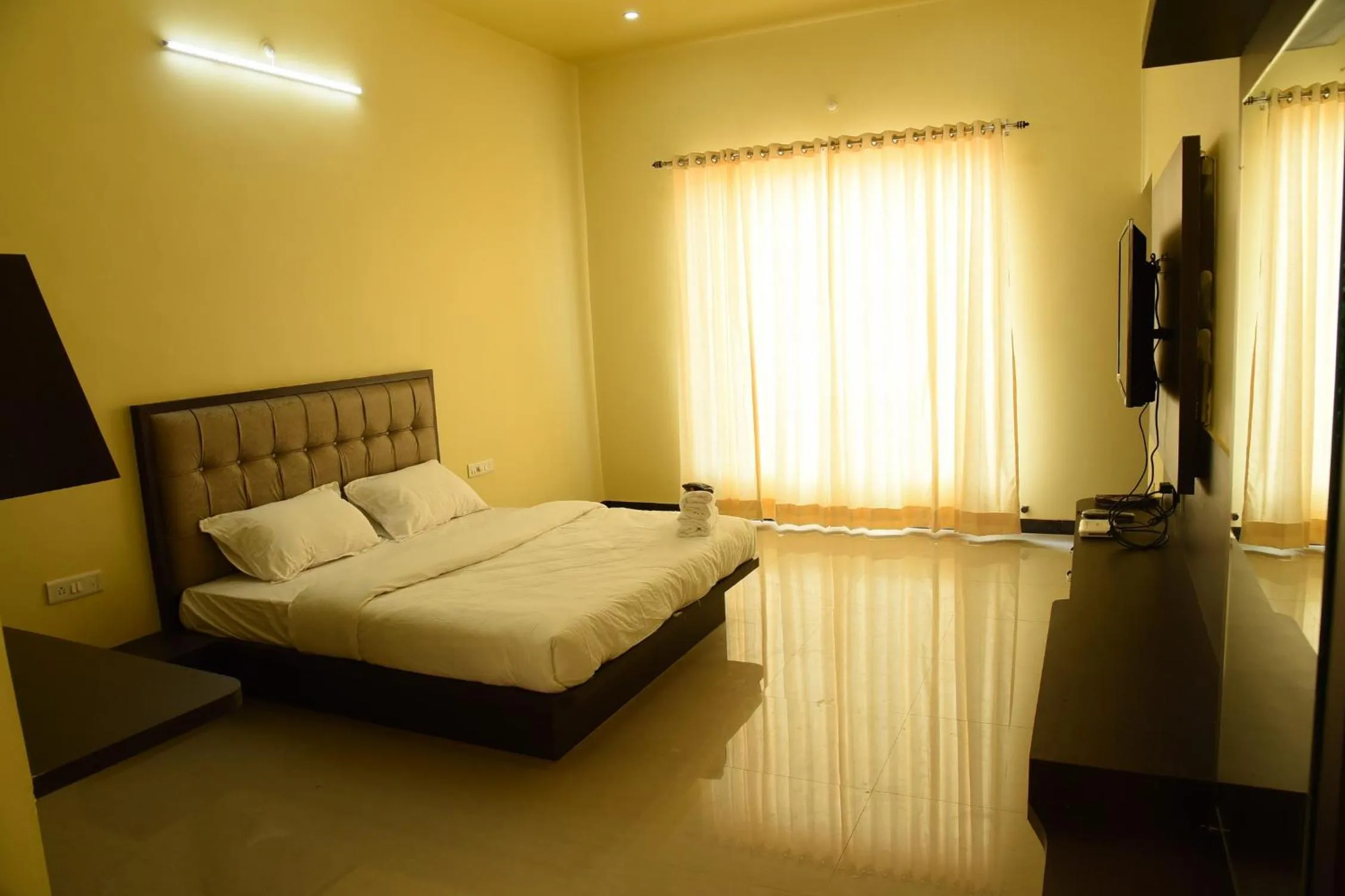 Bed in Chitrakoot Garden and Resorts