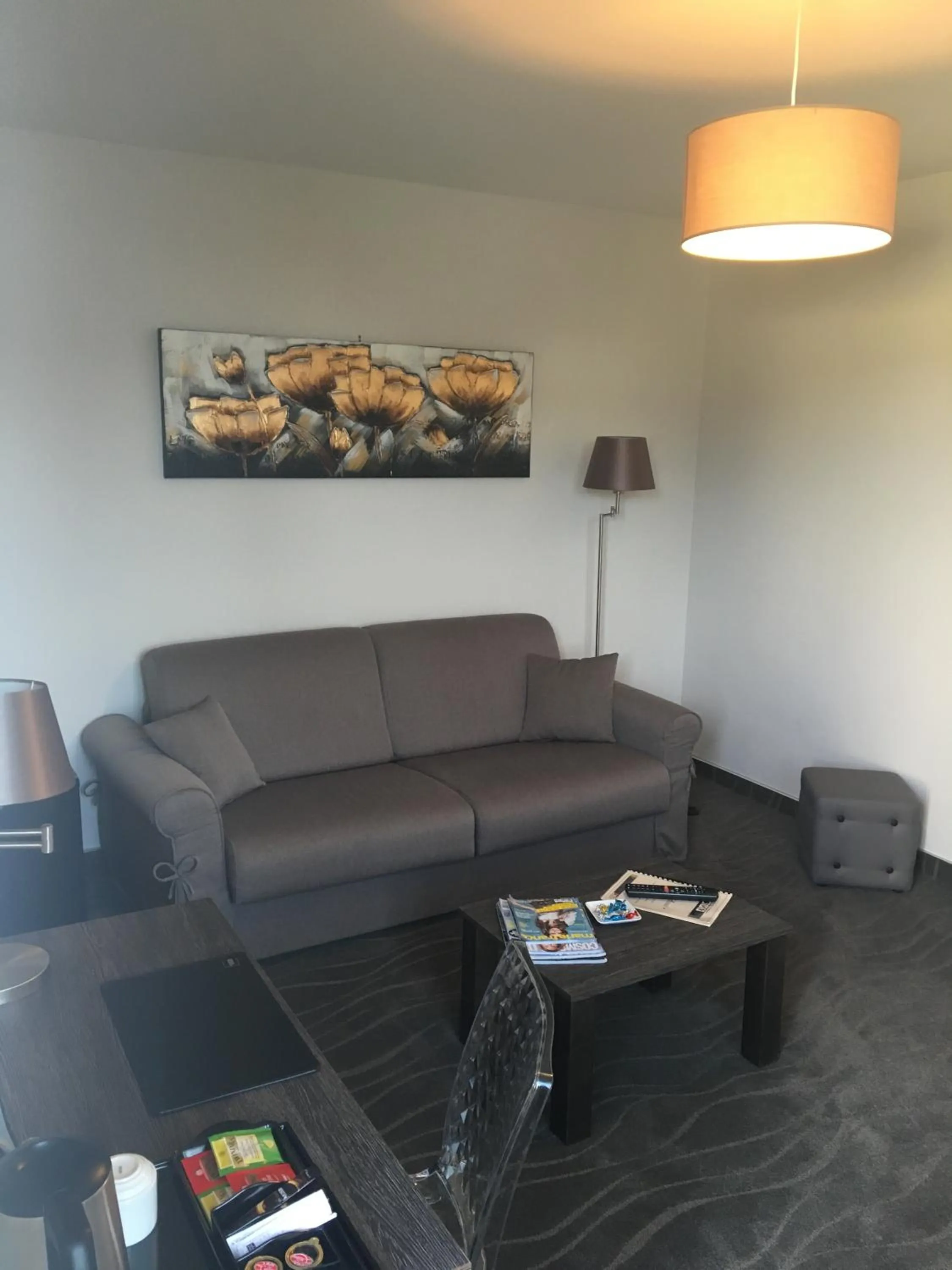 Seating area in Logis Auberge Des Moissons