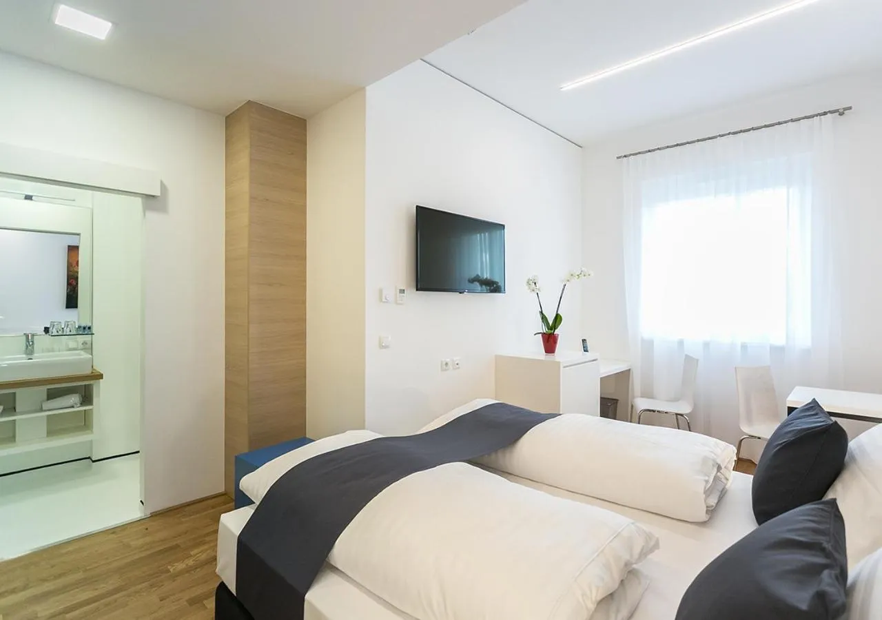 Bed in SHOME Hotel Graz I Self-Check-In I Free Parking