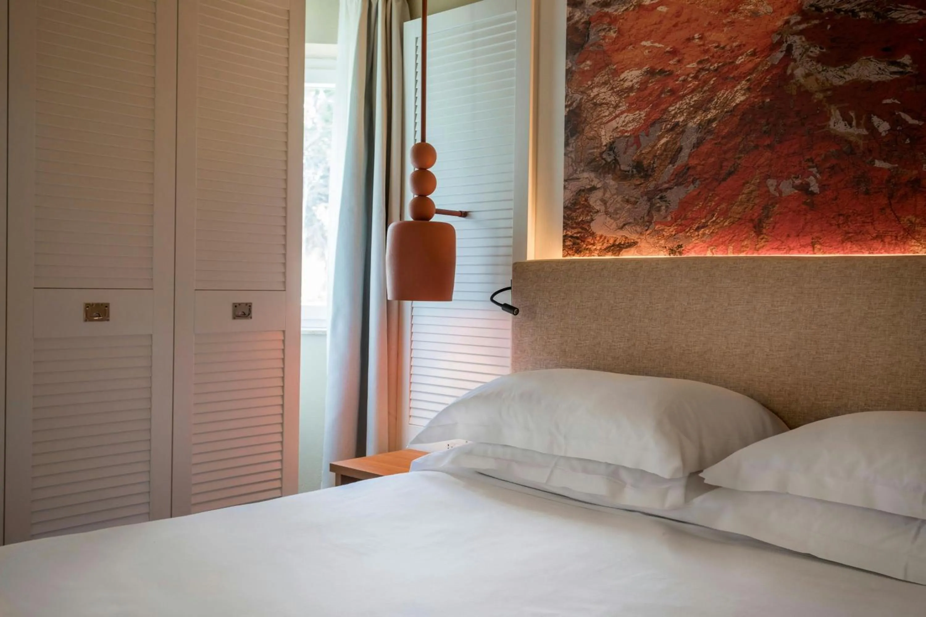 Photo of the whole room, Bed in Mangia's Brucoli, Sicily, Autograph Collection