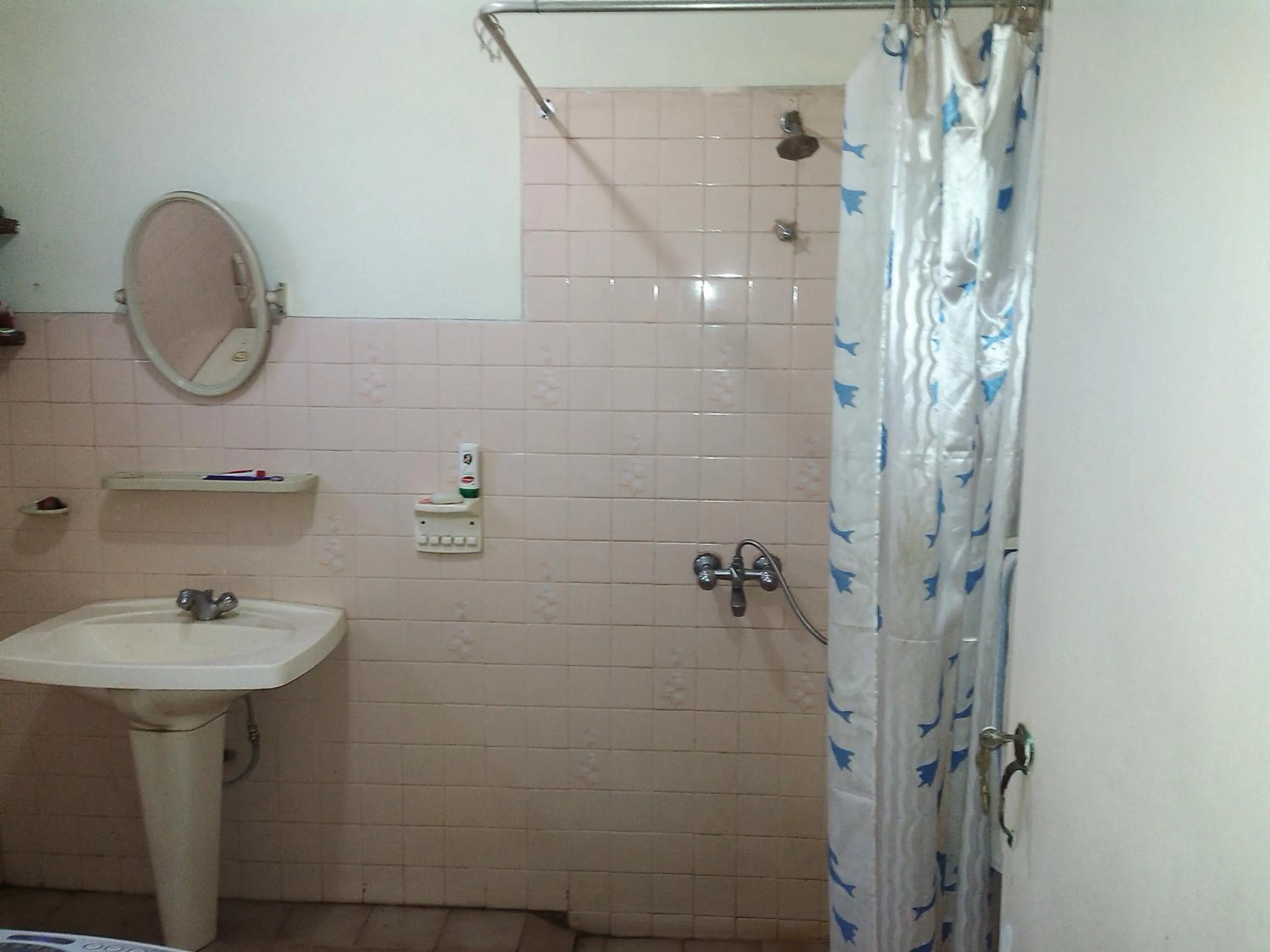 Shower in Mama's Hostel by Taprobane