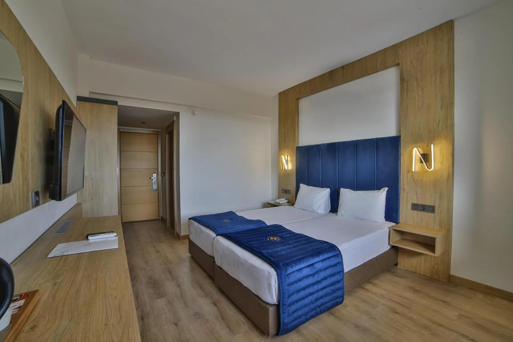 Bed in Nashira City Resort Hotel