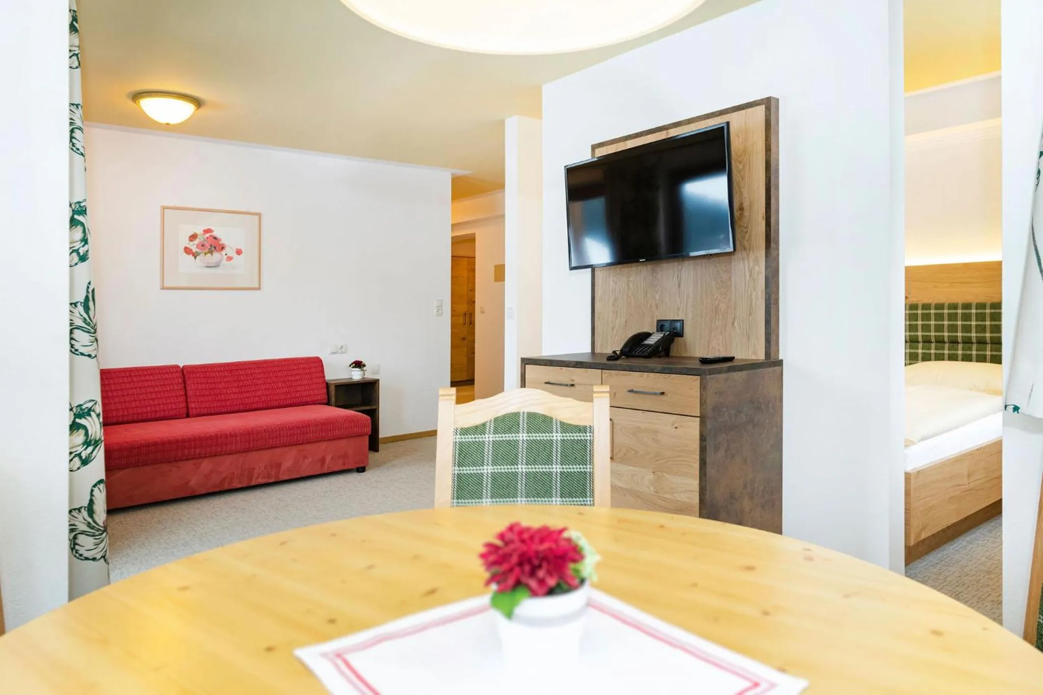 Living room, Bed in Landhotel Tirolerhof - Wildschönau - PREMIUM Card im Sommer