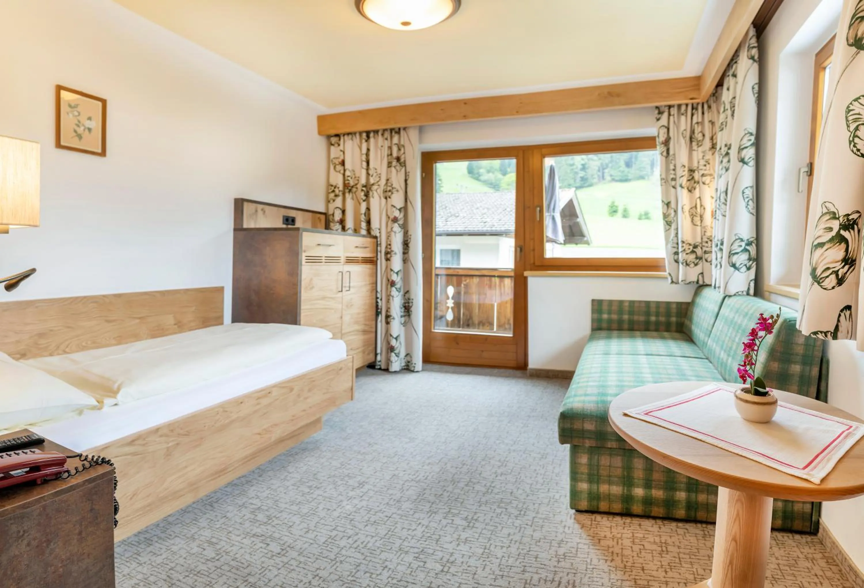 Photo of the whole room, Bed in Landhotel Tirolerhof - Wildschönau - PREMIUM Card im Sommer