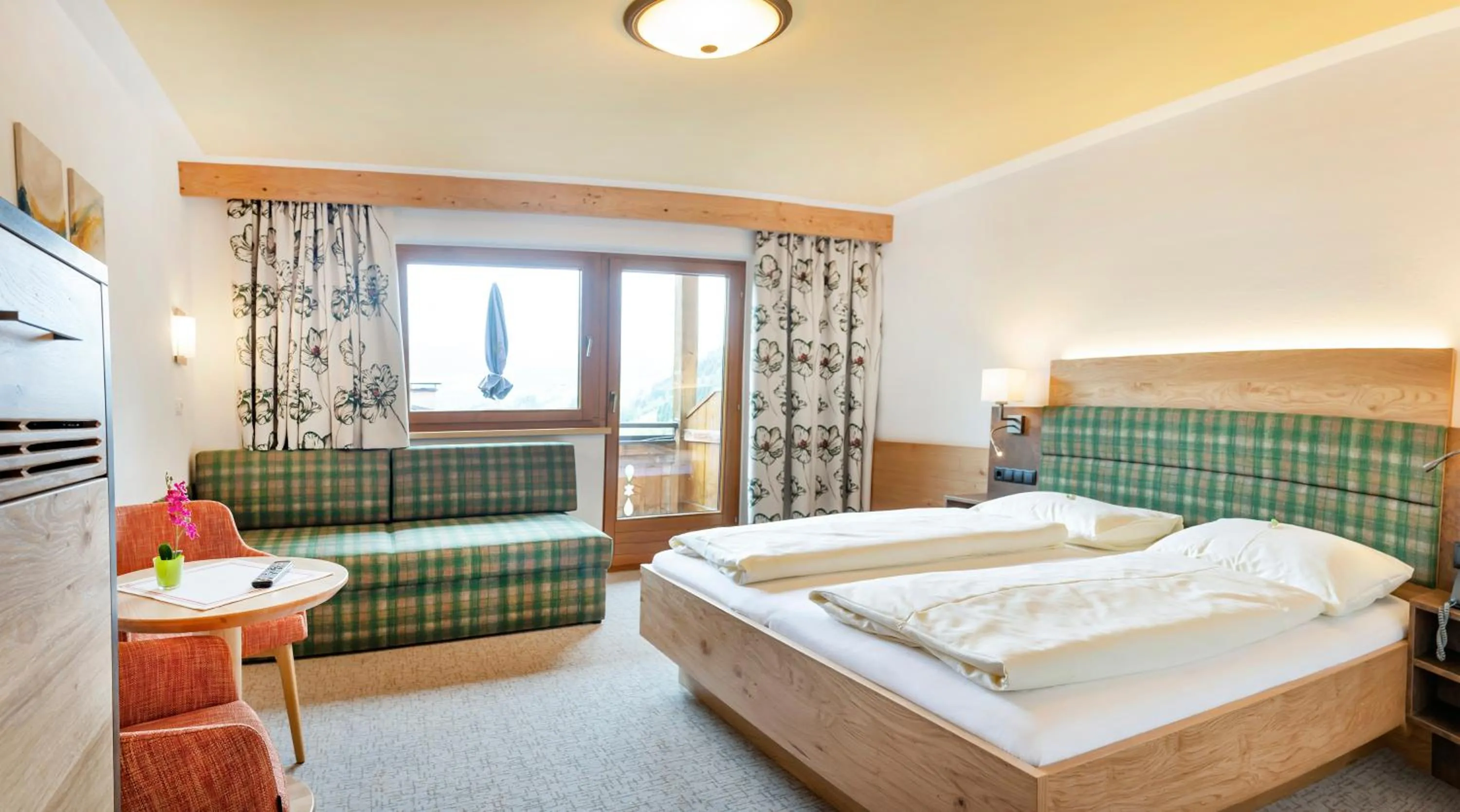 Photo of the whole room, Bed in Landhotel Tirolerhof - Wildschönau - PREMIUM Card im Sommer