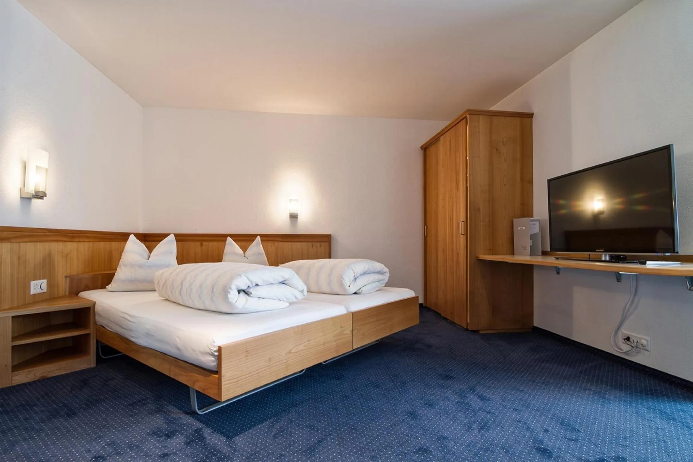 Photo of the whole room, Bed in Hotel Rössli Tufertschwil