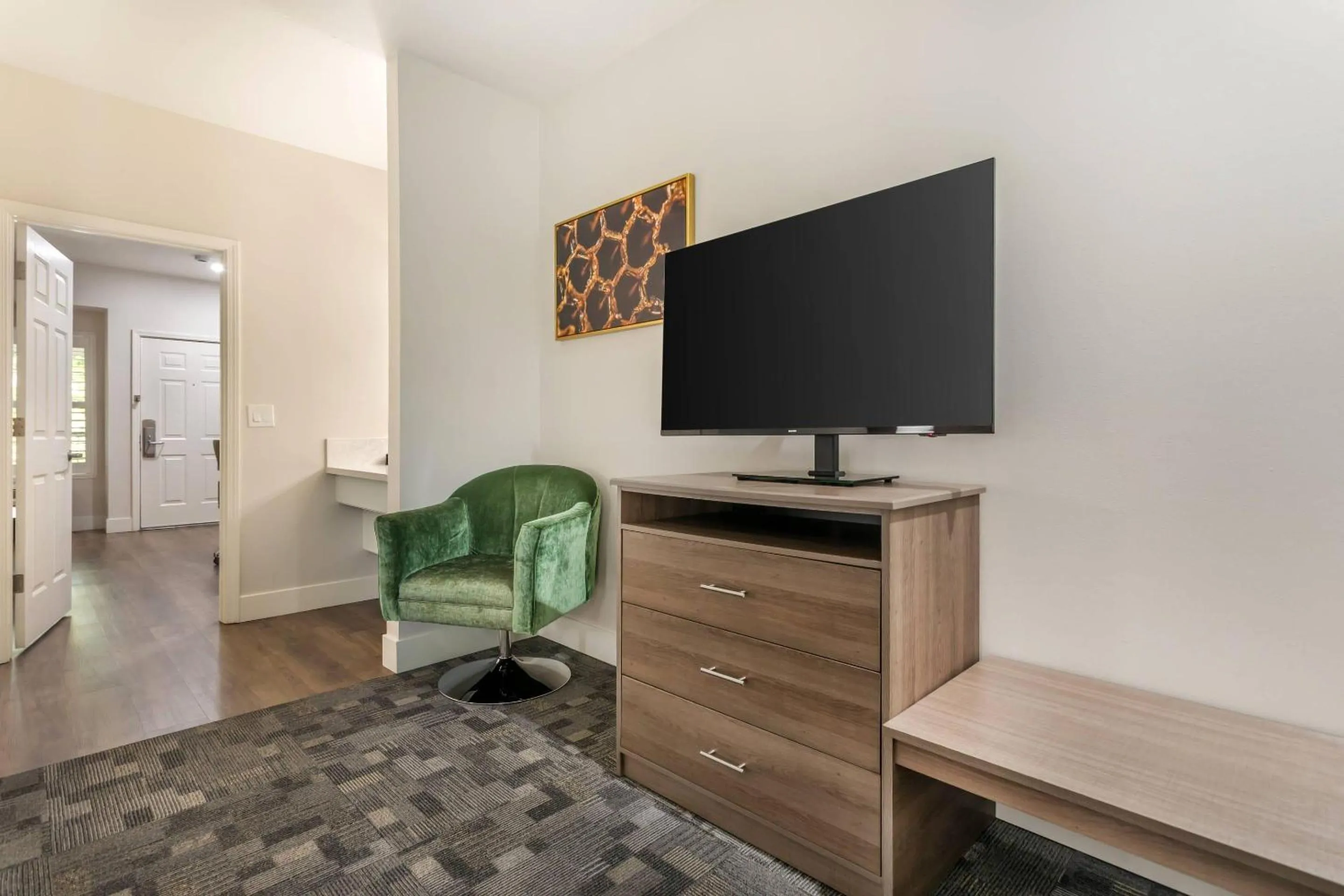 Bedroom in University Park Inn & Suites, an Ascend Collection Hotel