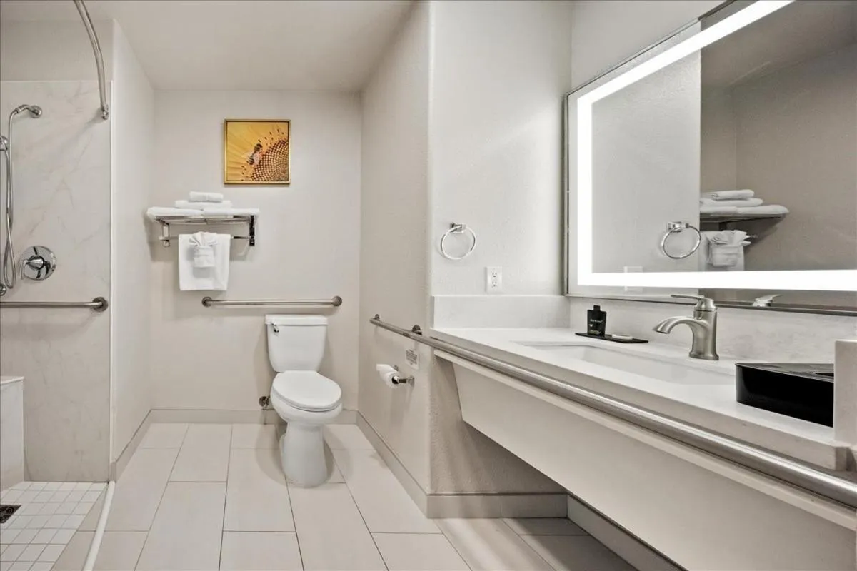 Bathroom in University Park Inn & Suites, an Ascend Collection Hotel