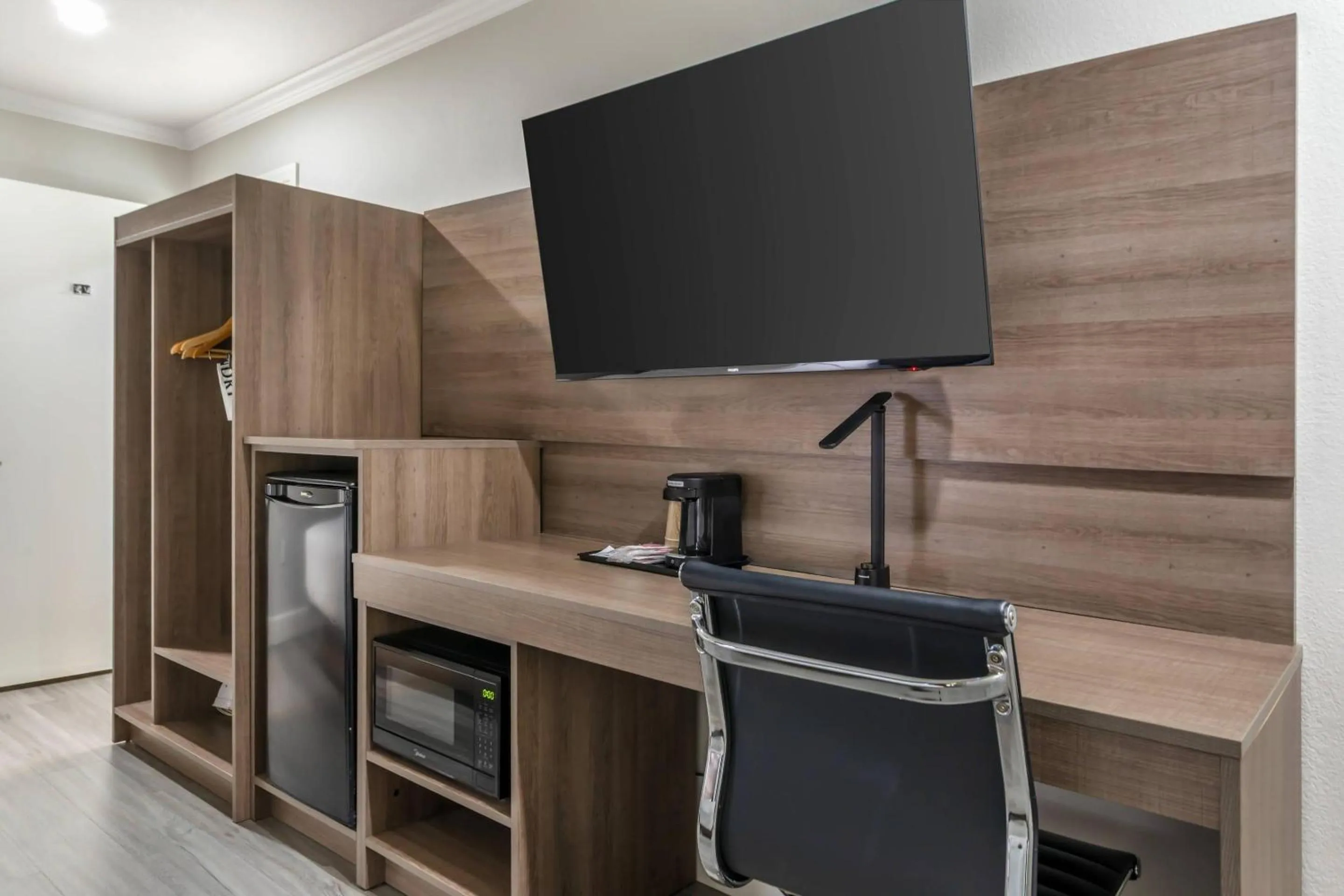 Bedroom in University Park Inn & Suites, an Ascend Collection Hotel