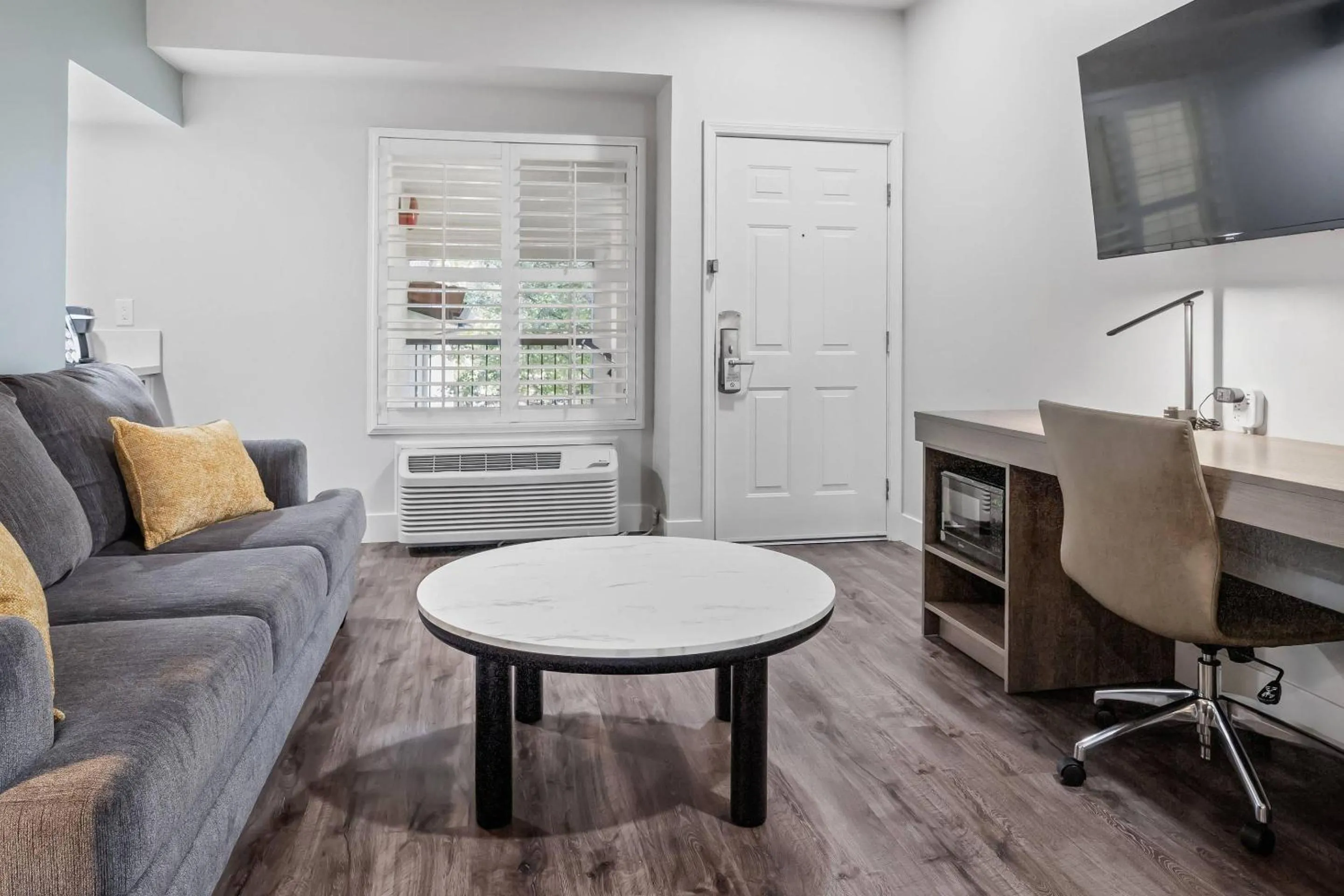 Bedroom in University Park Inn & Suites, an Ascend Collection Hotel