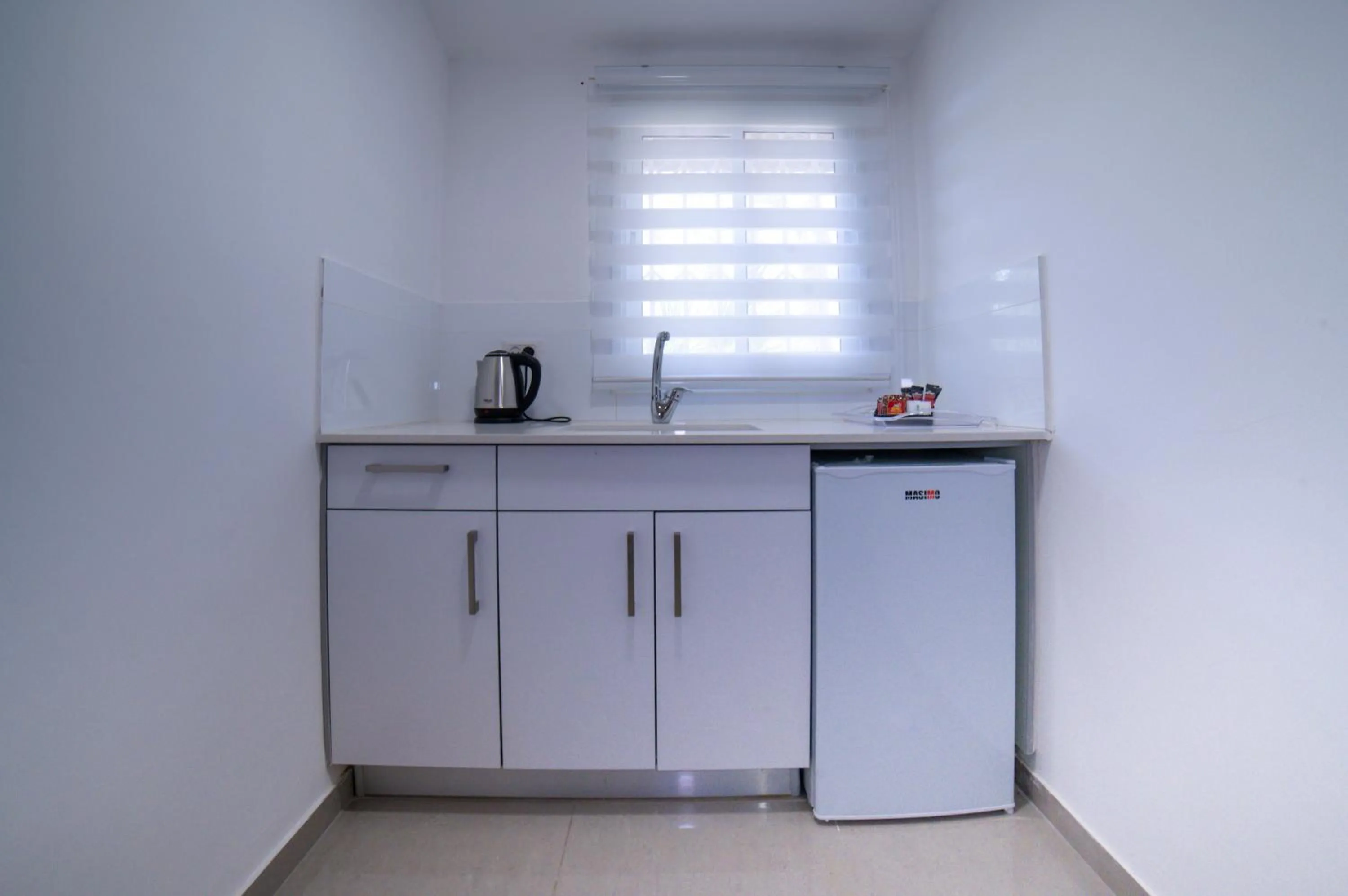 Kitchen or kitchenette in Agamim Hotel Ashkelon