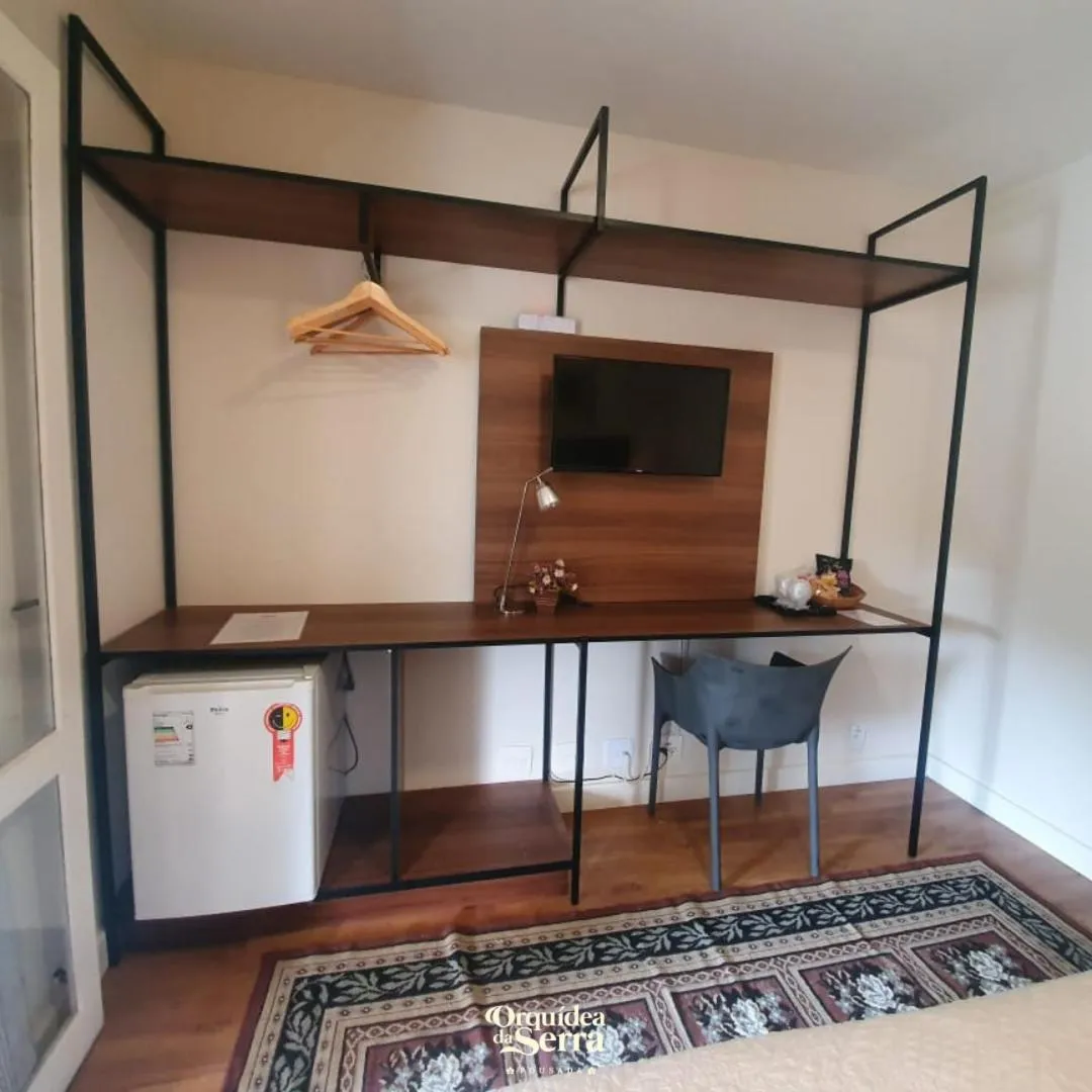 TV and multimedia in Pousada Orquidea da Serra