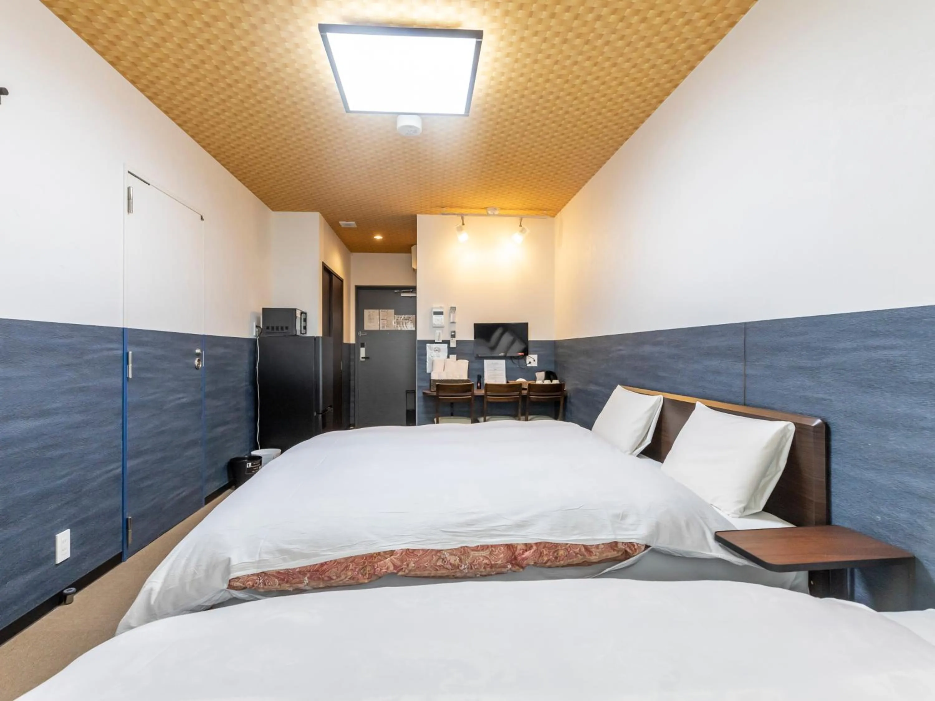 Bed in Tabist Kyogura Kyoto Nijo