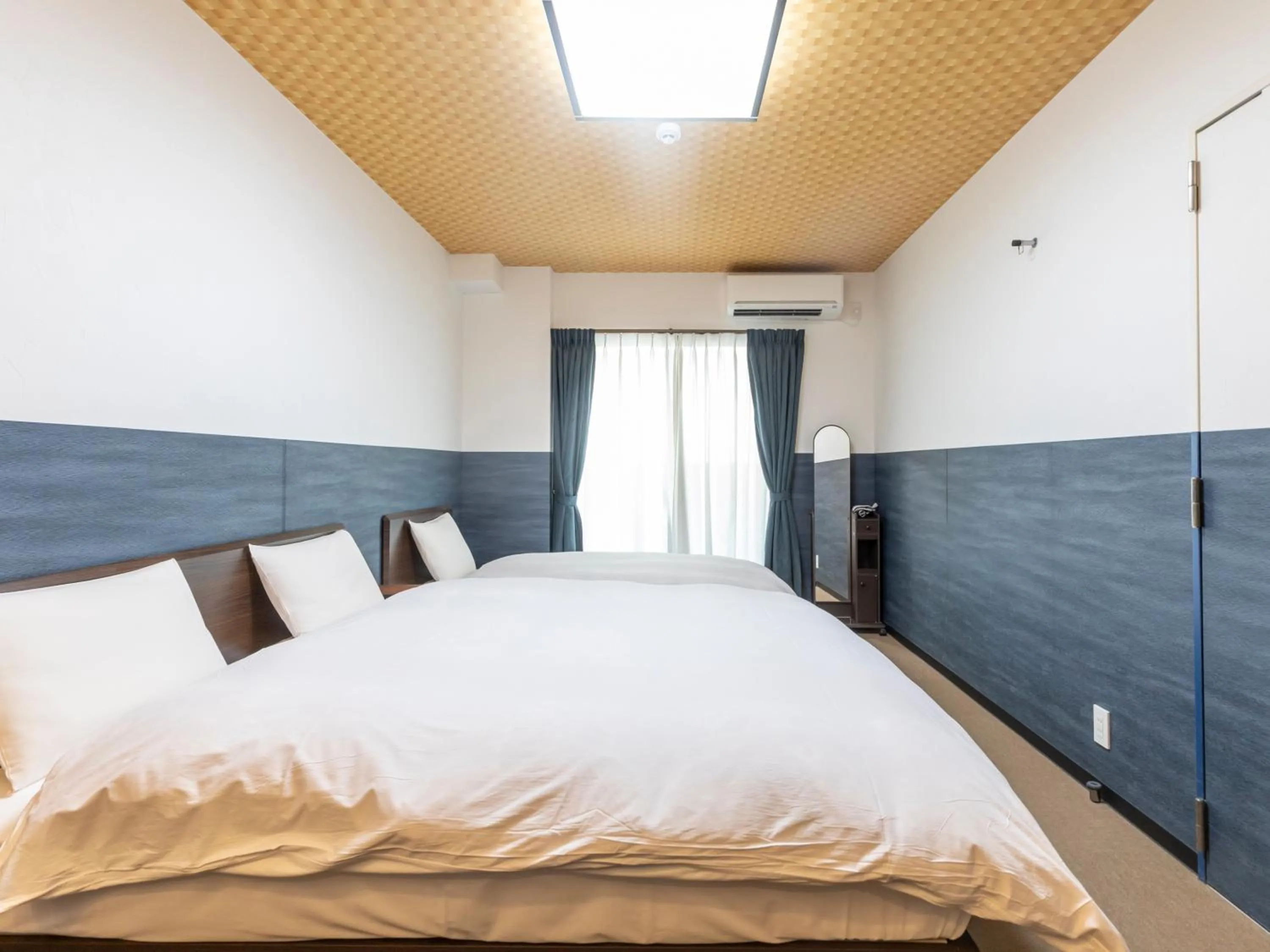 Bed in Tabist Kyogura Kyoto Nijo