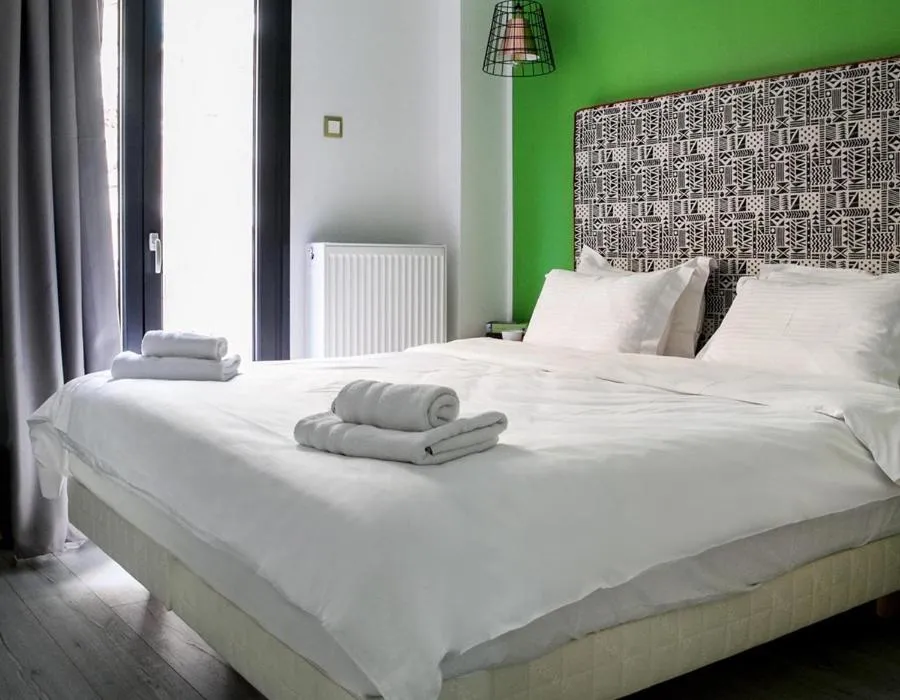 Bed in White Bottle Superior Apartments