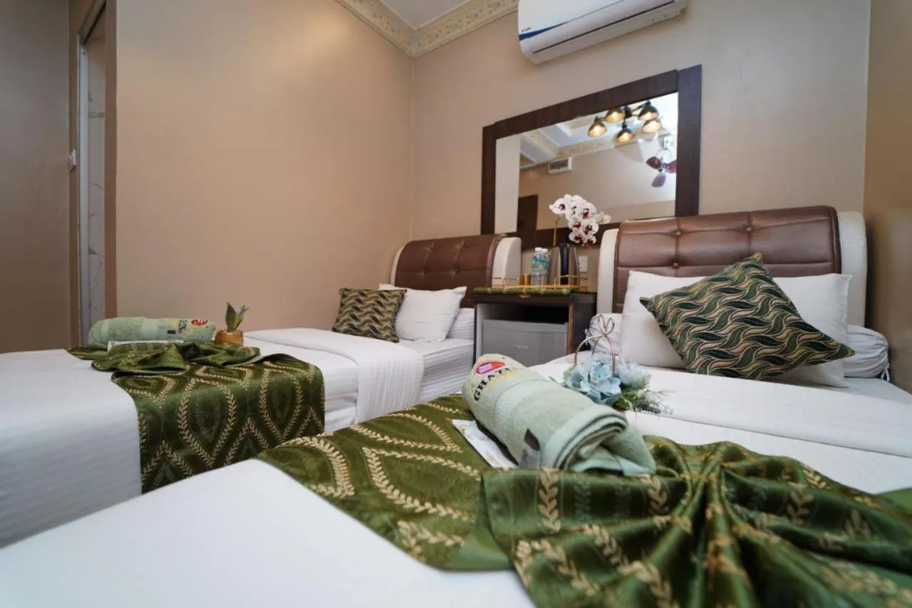 Bed in Ghazrin's Classic Hotel JB