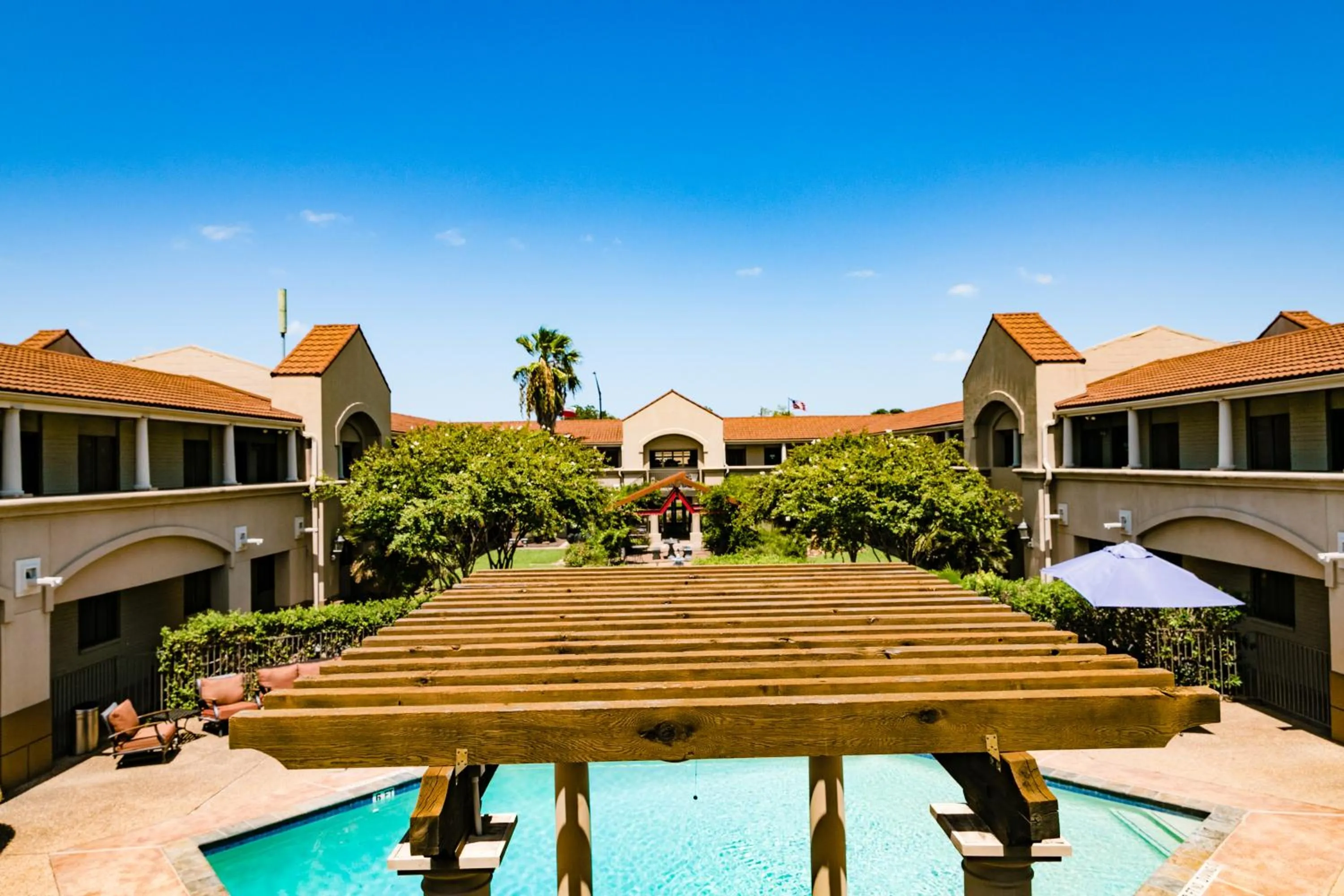 Pool view in Vineyard Court Designer Suites Hotel