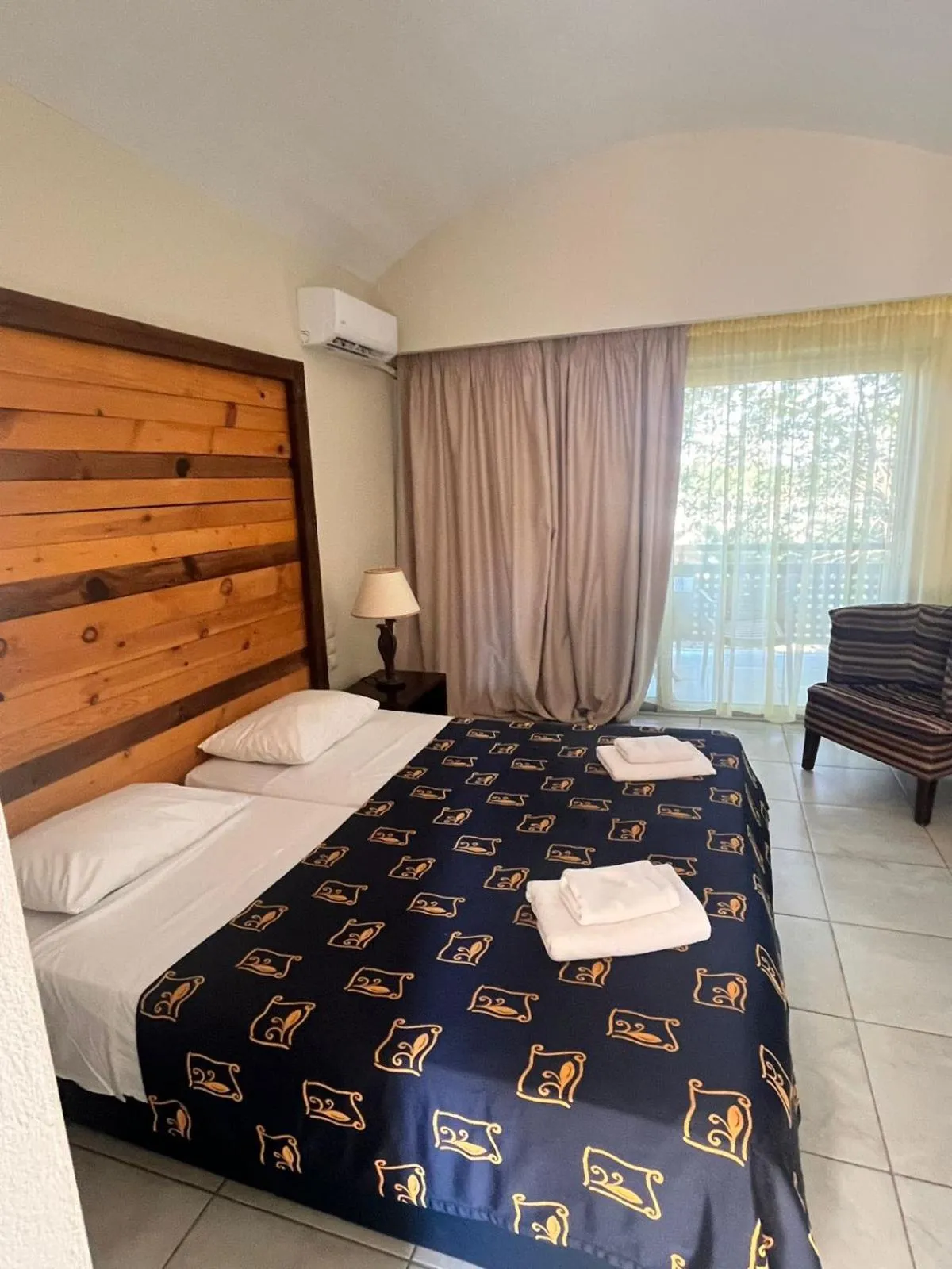 Bed in Olympian Bay Grand Resort